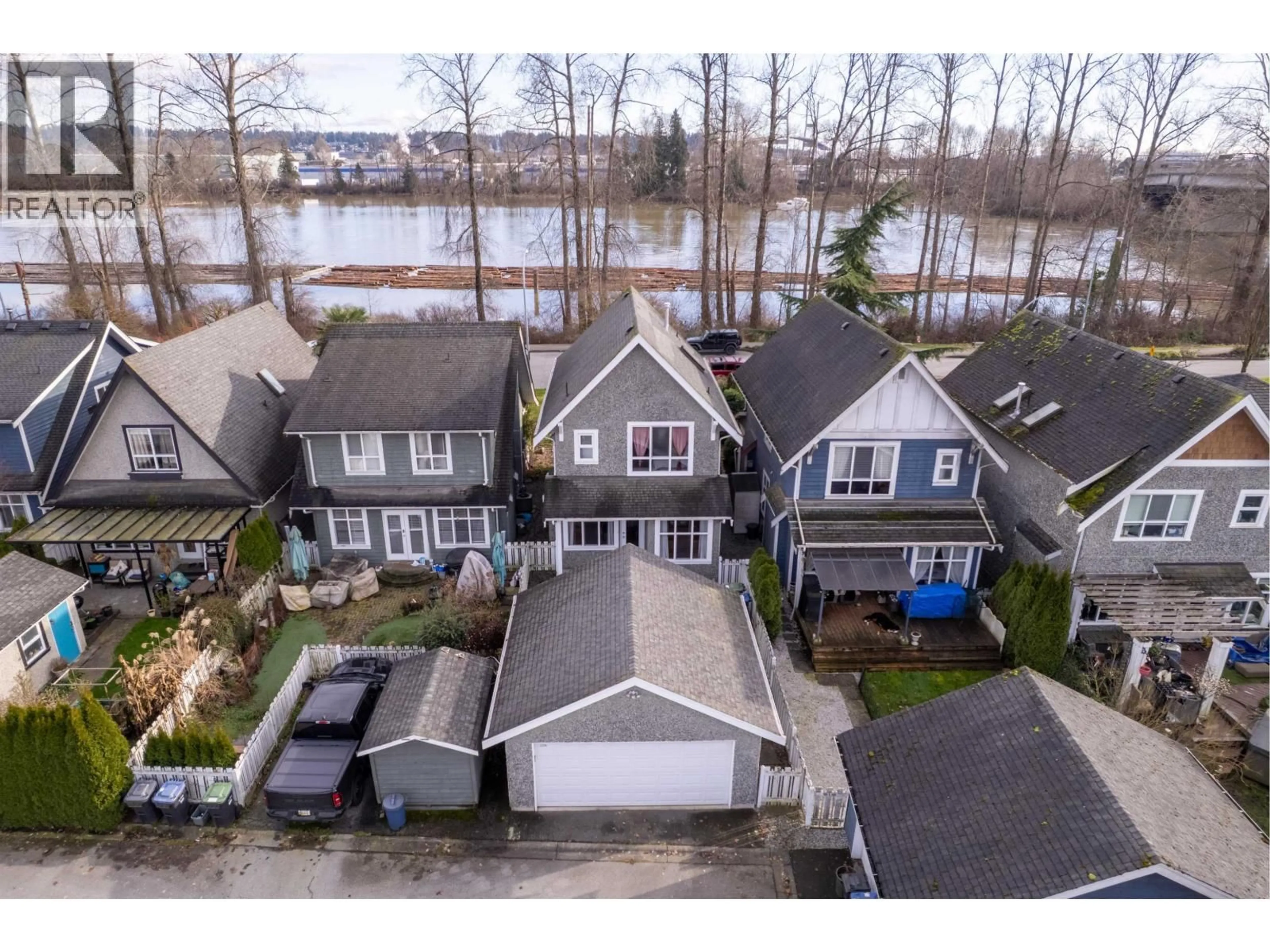 A pic from outside/outdoor area/front of a property/back of a property/a pic from drone, water/lake/river/ocean view for 1455 SOUTH DYKE ROAD, New Westminster British Columbia V3M7A2