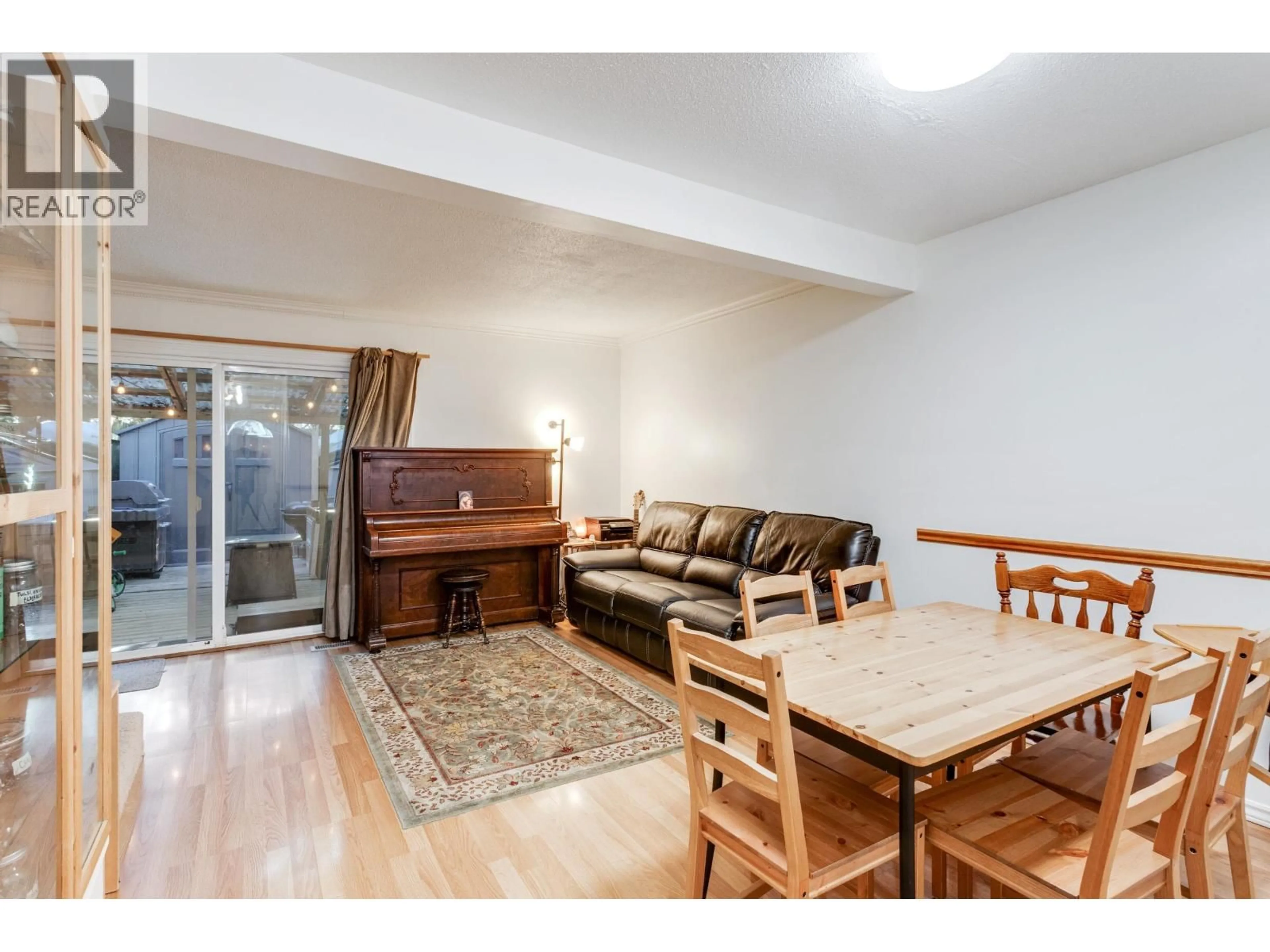 Living room with furniture, wood/laminate floor for 8918 GANYMEDE PLACE, Burnaby British Columbia V3J1A1