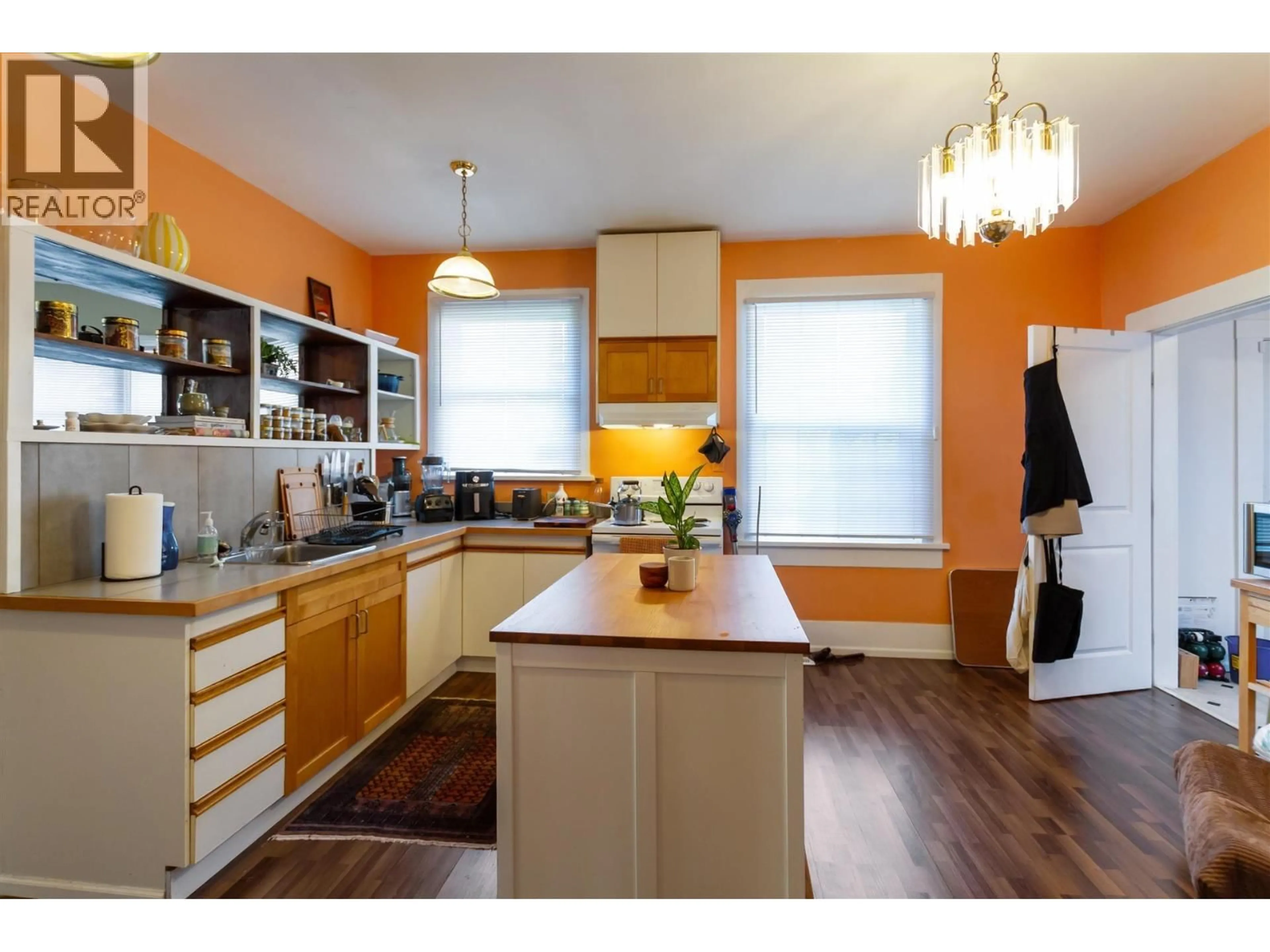 Open concept kitchen, wood/laminate floor for 1925 ADANAC STREET, Vancouver British Columbia V5L2E5