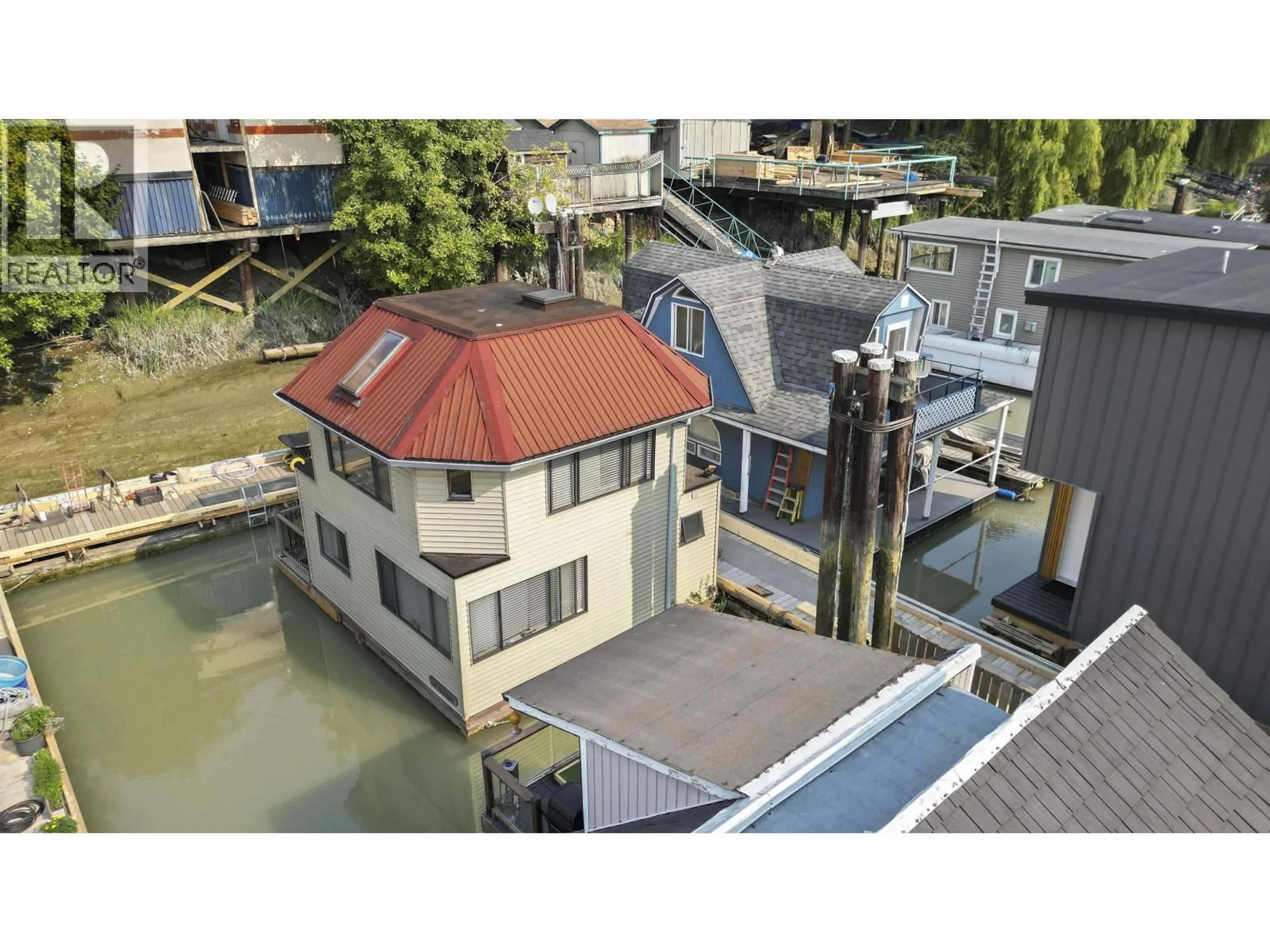 A pic from outside/outdoor area/front of a property/back of a property/a pic from drone, unknown for 10 - 23000 DYKE ROAD, Richmond British Columbia V6V2H3