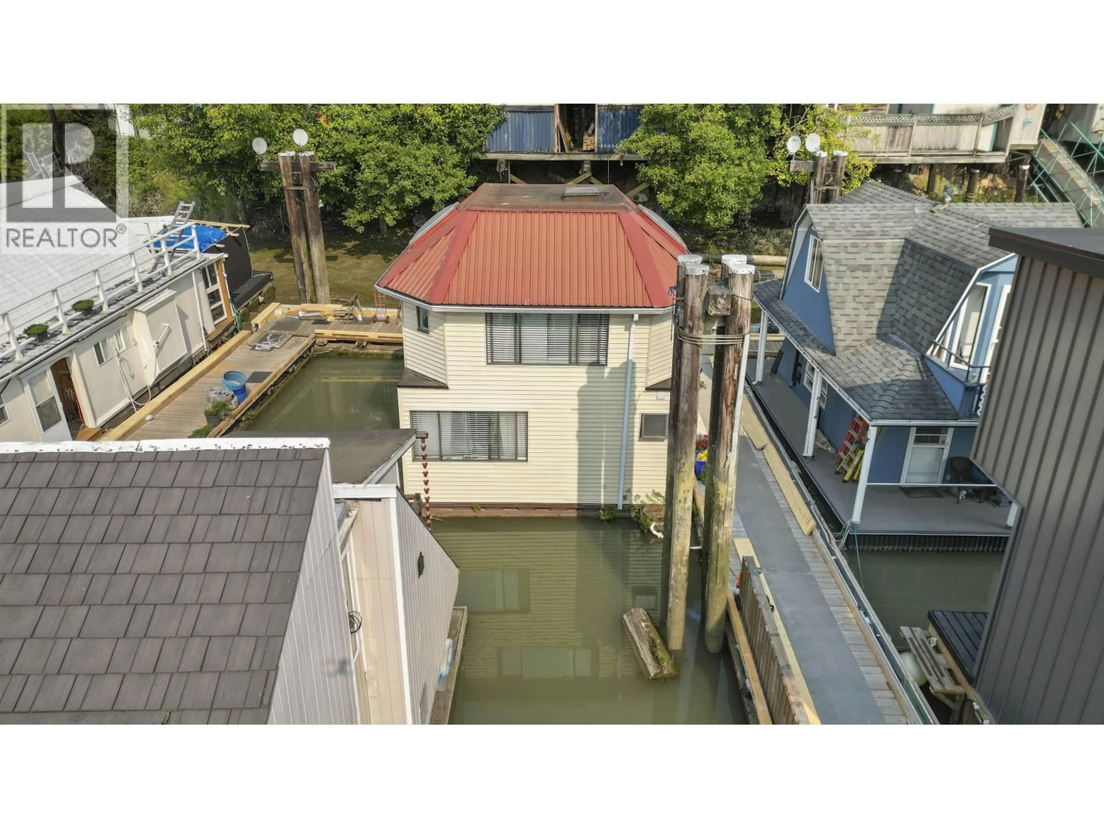 A pic from outside/outdoor area/front of a property/back of a property/a pic from drone, water/lake/river/ocean view for 10 - 23000 DYKE ROAD, Richmond British Columbia V6V2H3