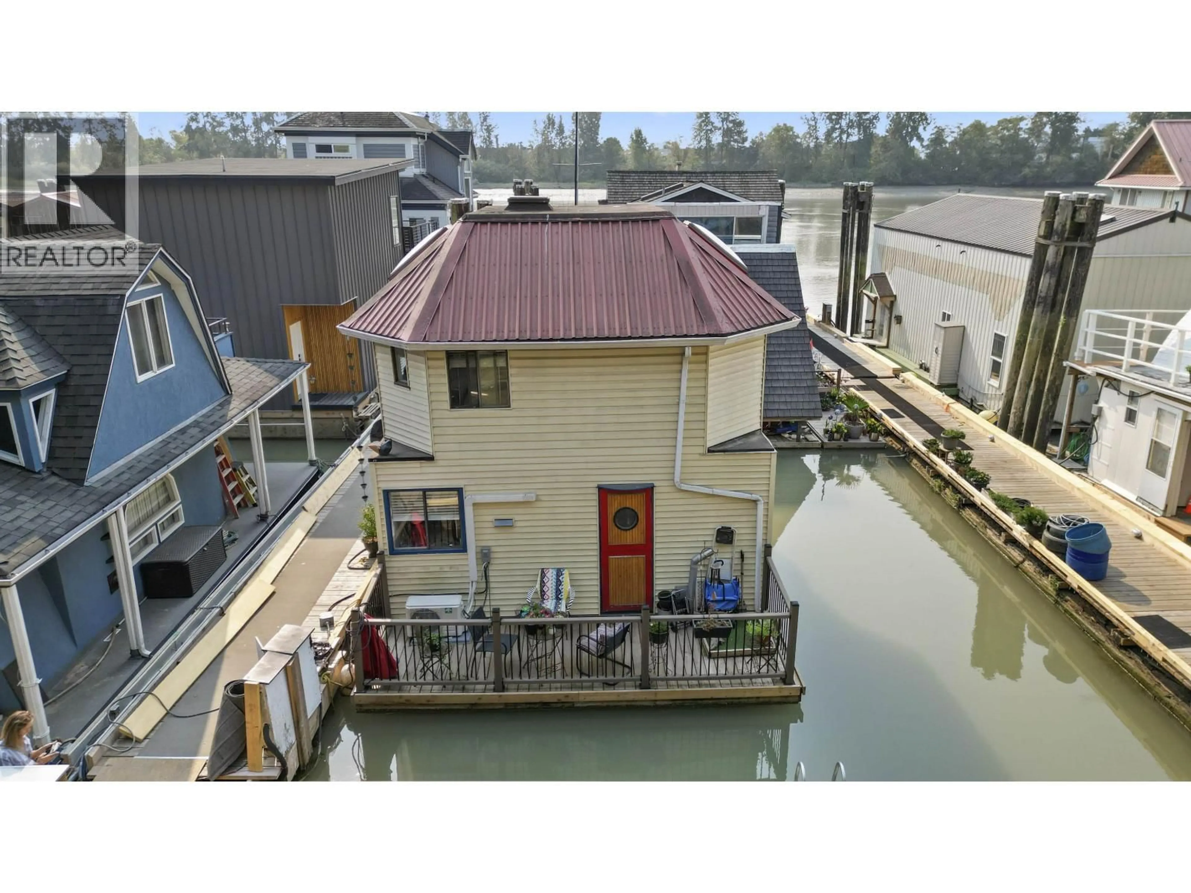 A pic from outside/outdoor area/front of a property/back of a property/a pic from drone, water/lake/river/ocean view for 10 - 23000 DYKE ROAD, Richmond British Columbia V6V2H3
