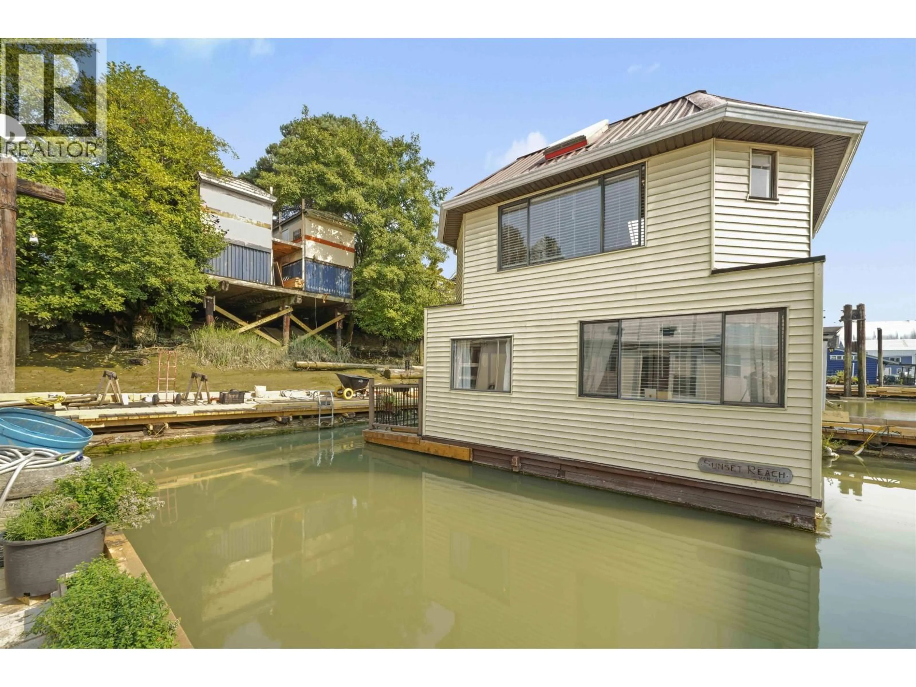 A pic from outside/outdoor area/front of a property/back of a property/a pic from drone, water/lake/river/ocean view for 10 - 23000 DYKE ROAD, Richmond British Columbia V6V2H3