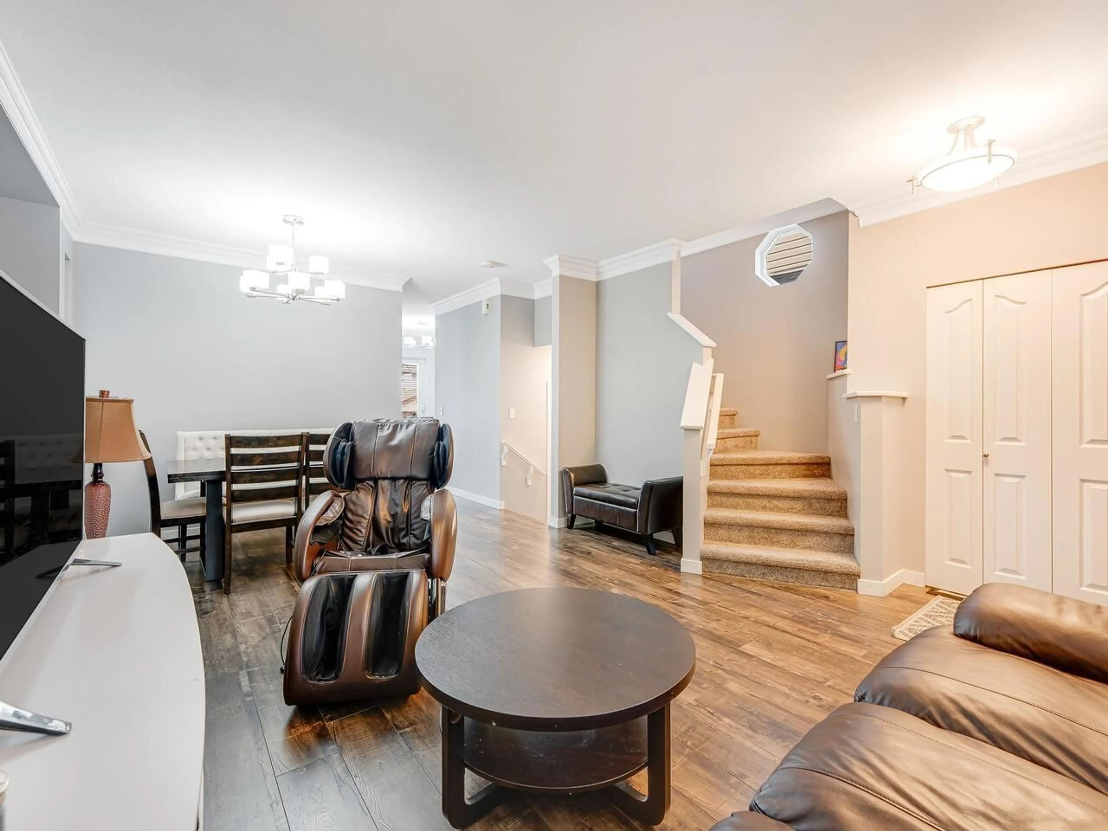 Living room with furniture, wood/laminate floor for 18529 67A AVENUE, Surrey British Columbia V3S9B5