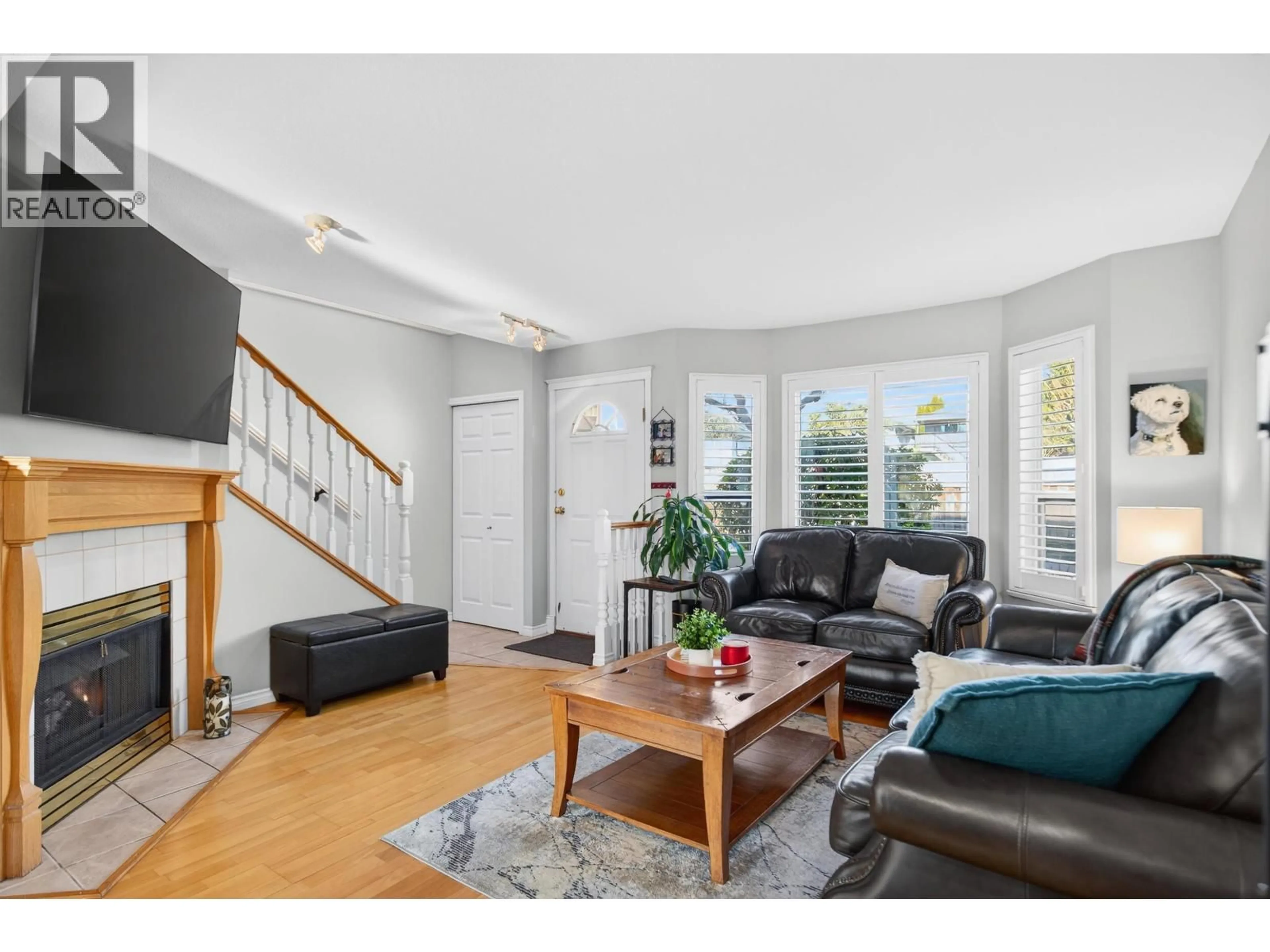 Living room with furniture, wood/laminate floor for 67 - 11588 232 STREET, Maple Ridge British Columbia V2X0J6