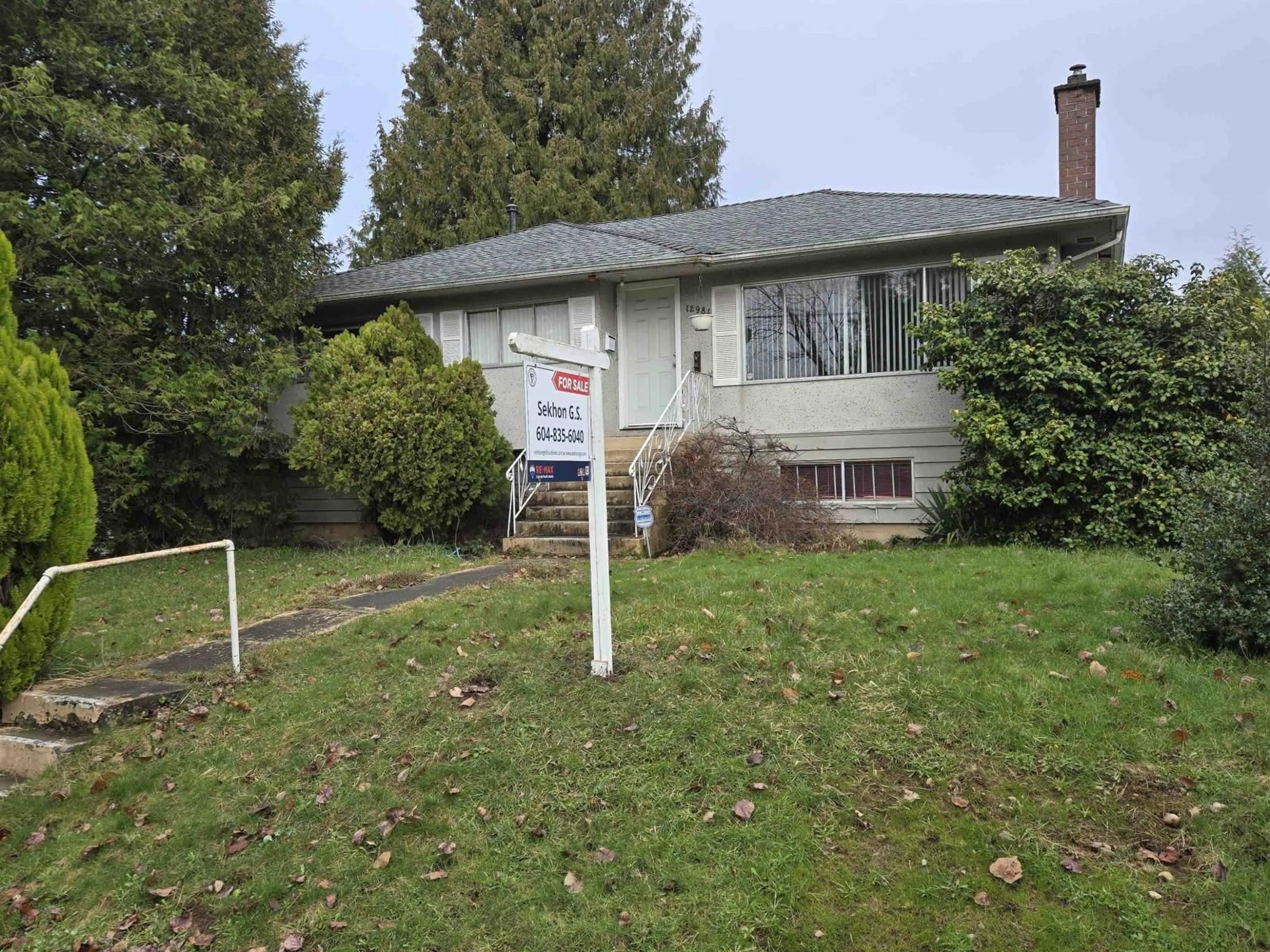 Home with vinyl exterior material, street for 12981 100A AVENUE, Surrey British Columbia V3T1J8