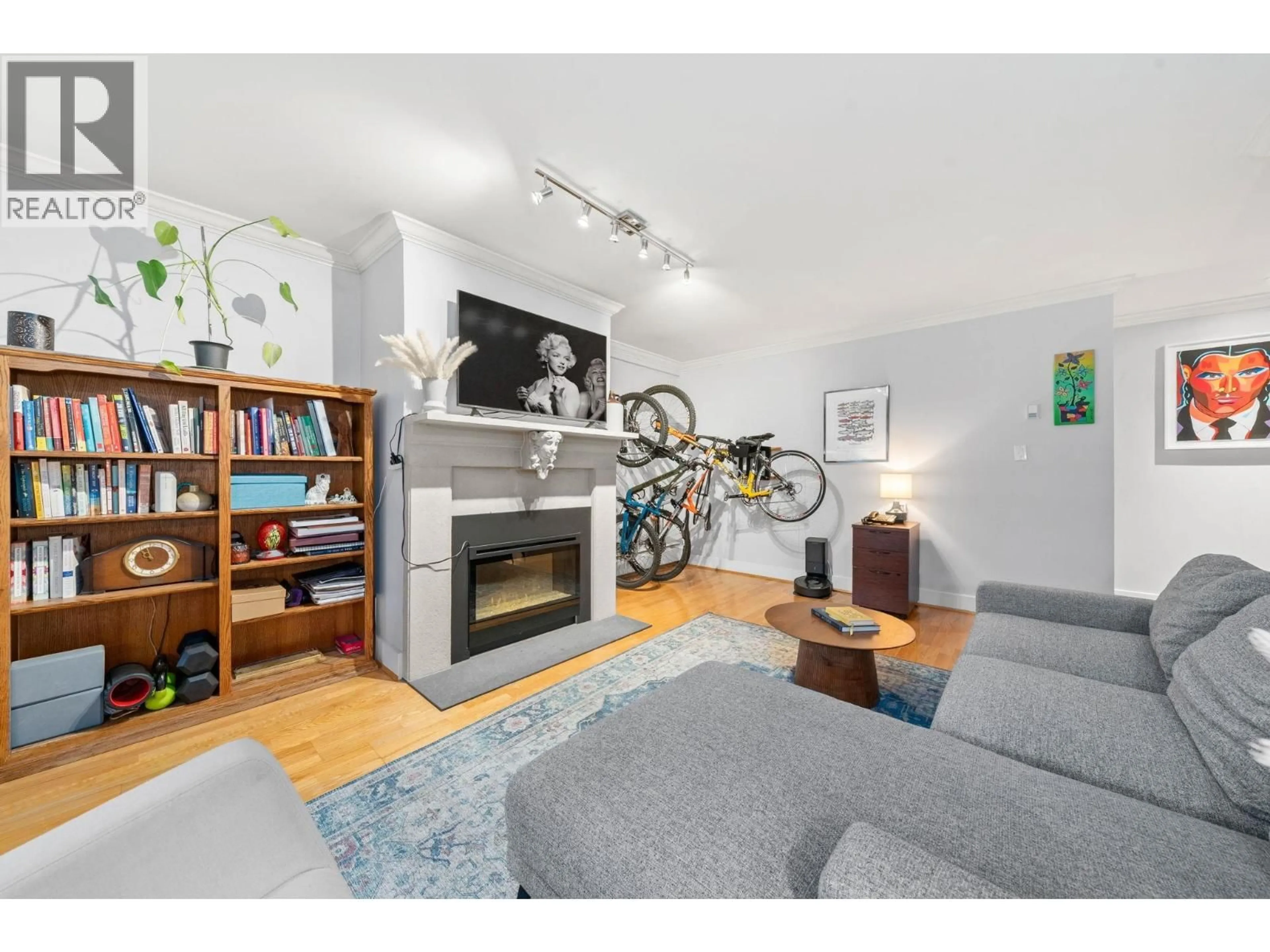 Living room with furniture, wood/laminate floor for 209 - 1720 12TH AVENUE, Vancouver British Columbia V6J2E6