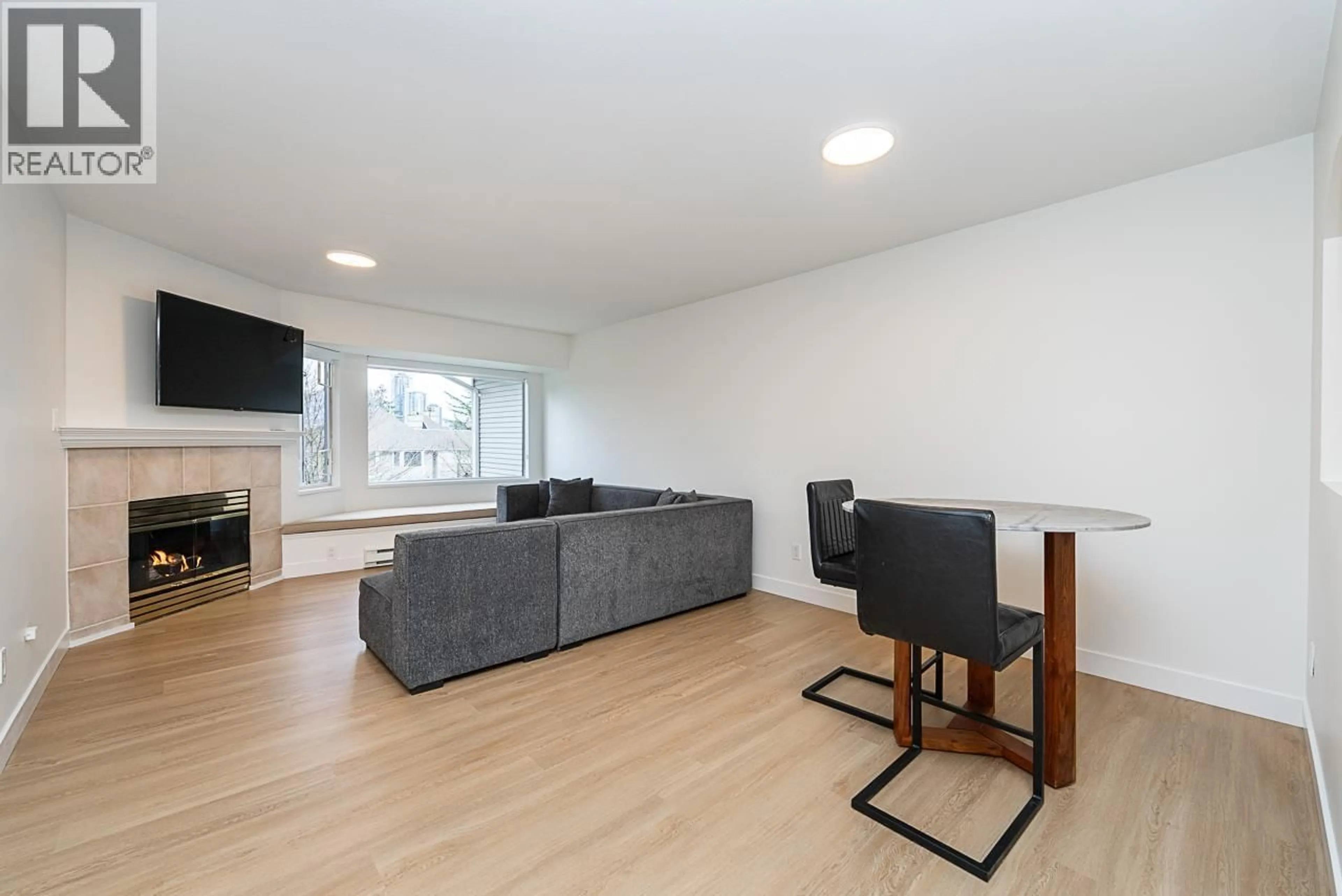 Living room with furniture, wood/laminate floor for 303 - 3738 NORFOLK STREET, Burnaby British Columbia V5G4V4