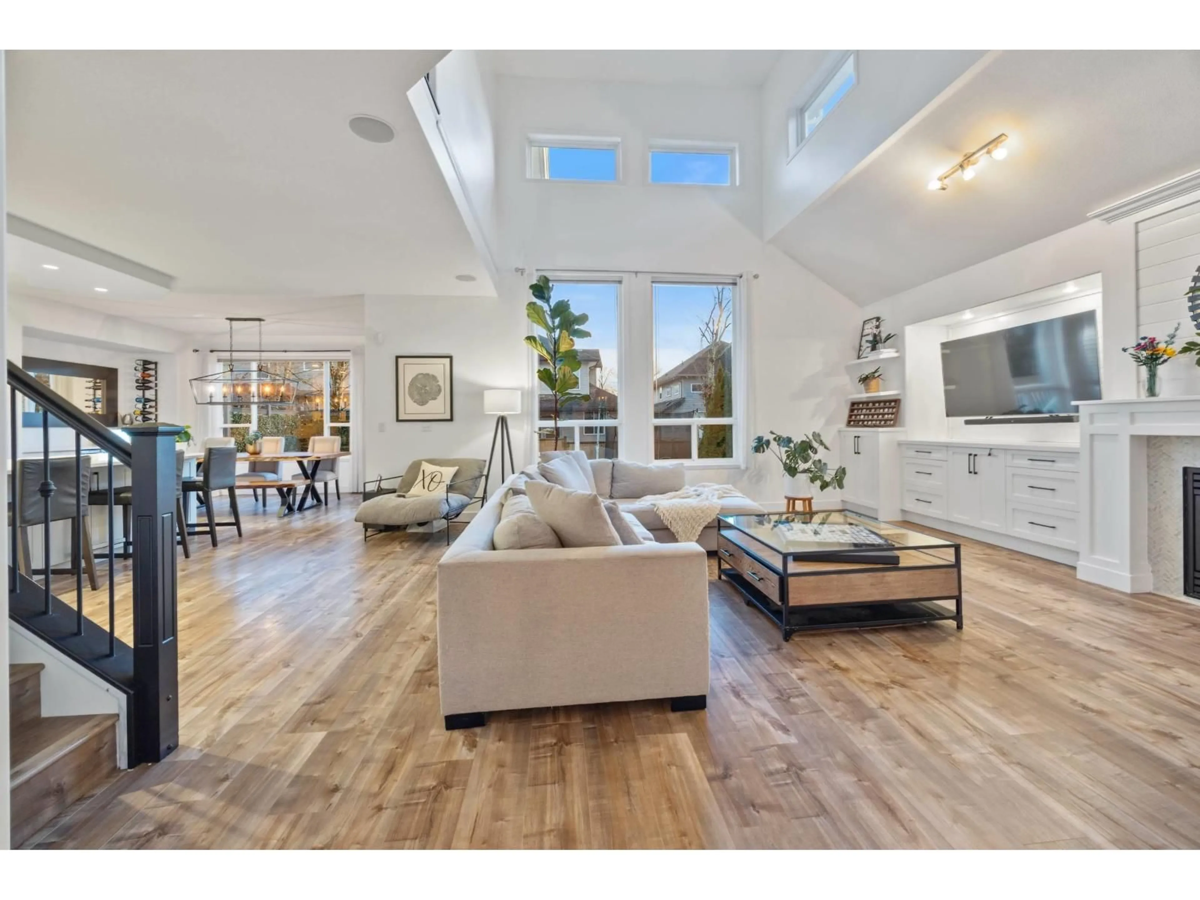 Living room with furniture, wood/laminate floor for 18962 68B AVENUE, Surrey British Columbia V4N5J9