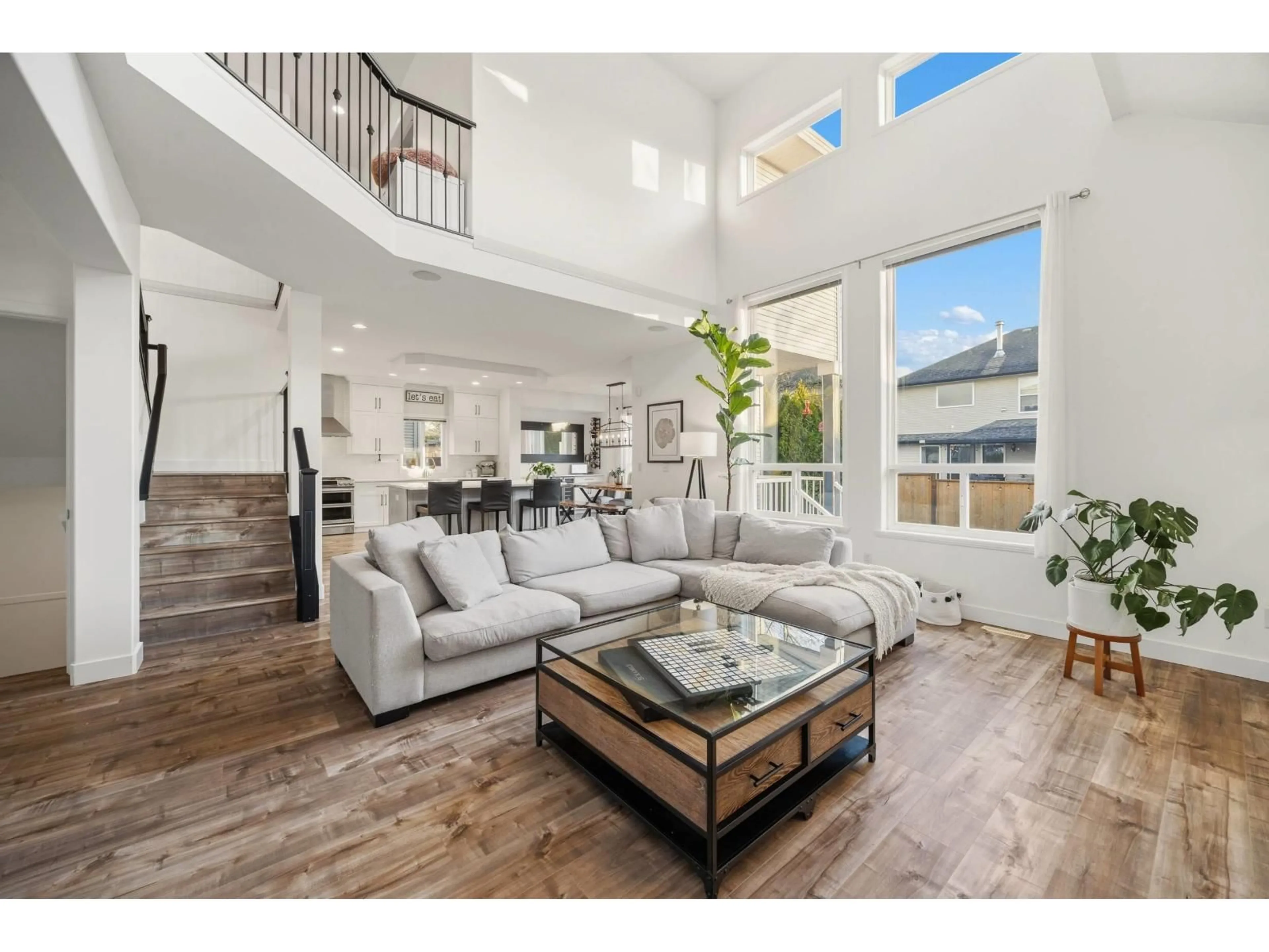 Living room with furniture, wood/laminate floor for 18962 68B AVENUE, Surrey British Columbia V4N5J9