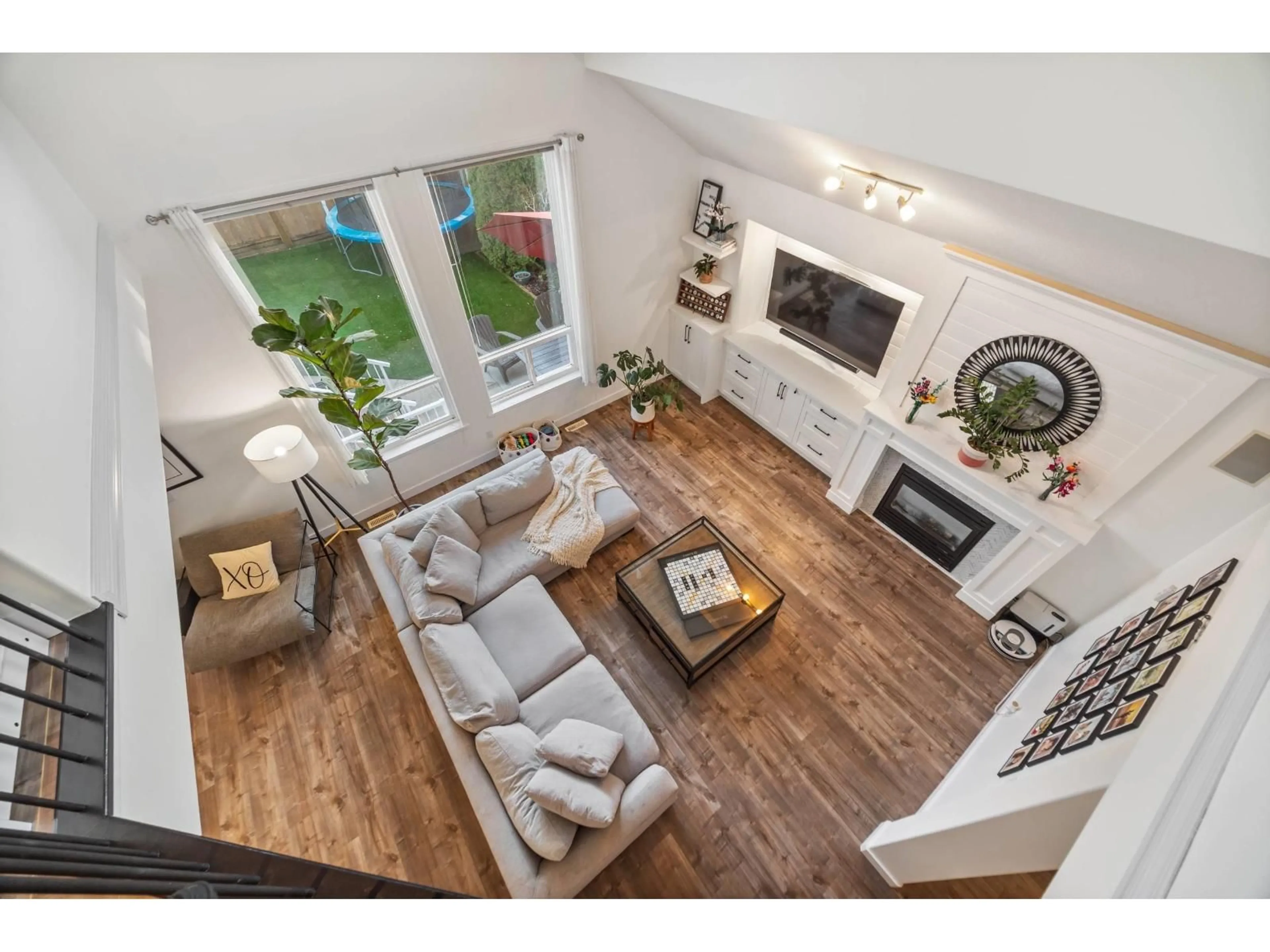 Living room with furniture, wood/laminate floor for 18962 68B AVENUE, Surrey British Columbia V4N5J9