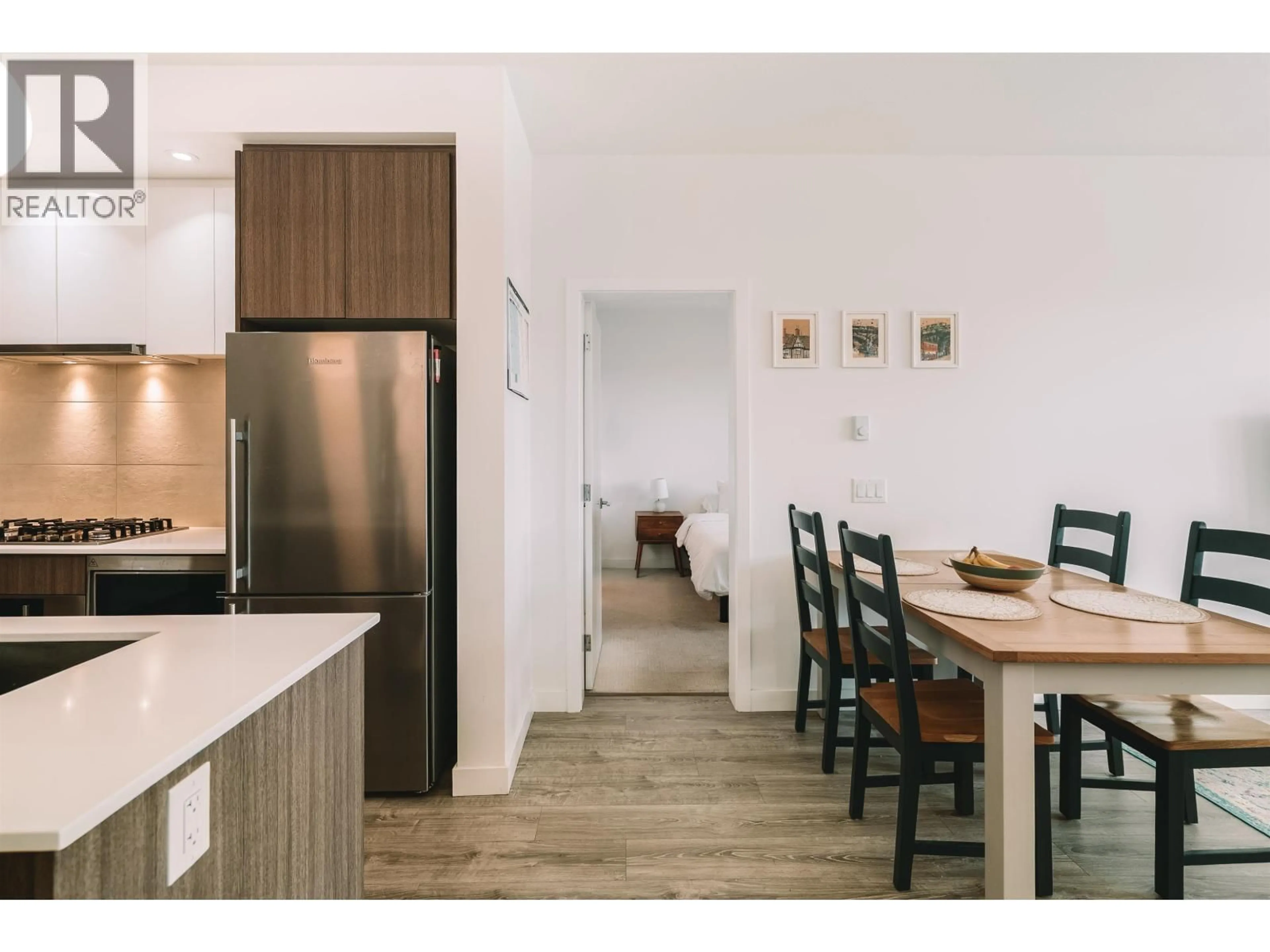 Open concept kitchen, wood/laminate floor for 402 - 516 FOSTER AVENUE, Coquitlam British Columbia V3J0H8