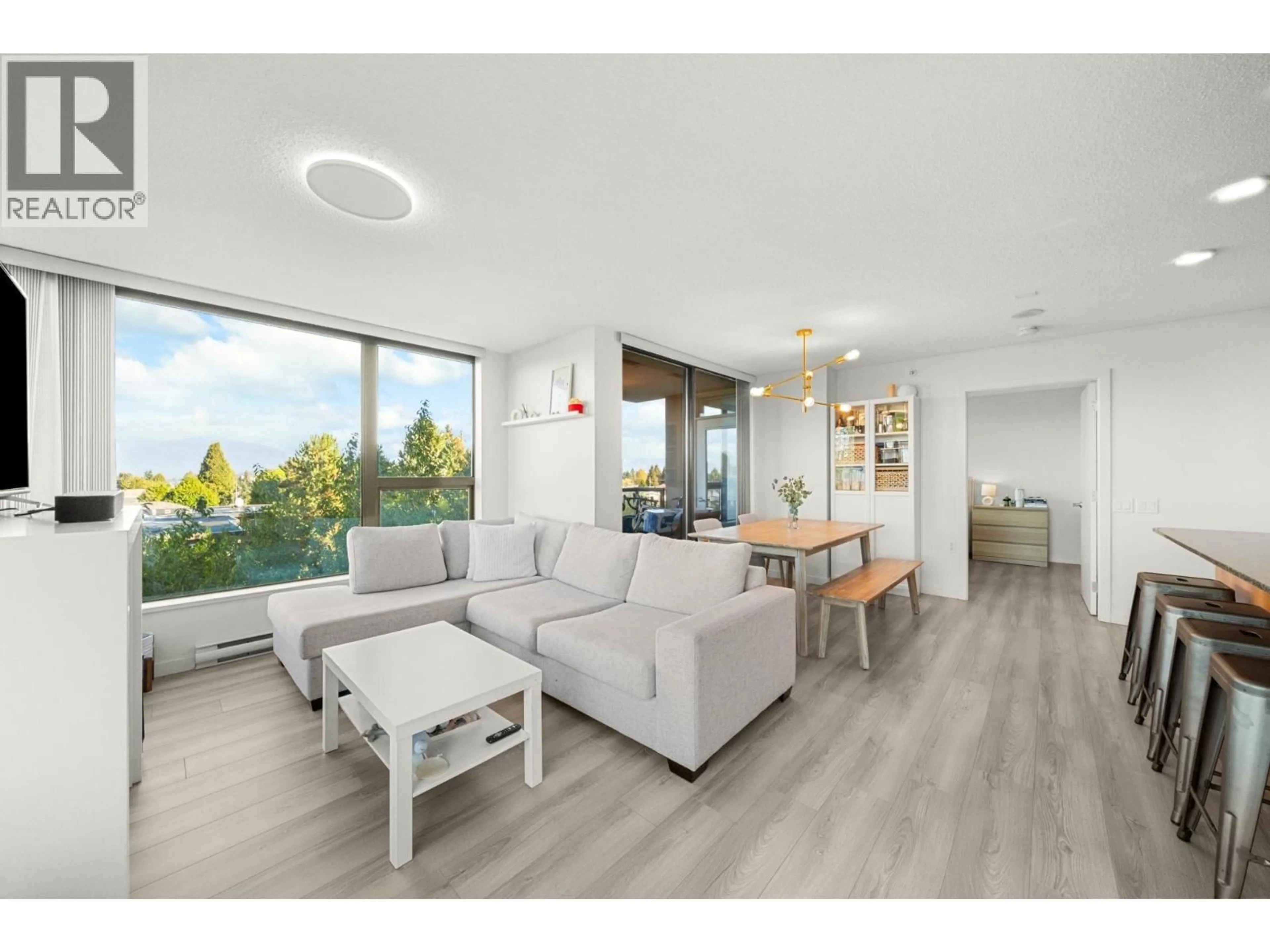 Living room with furniture, wood/laminate floor for 503 - 7108 COLLIER STREET, Burnaby British Columbia V5E0A1