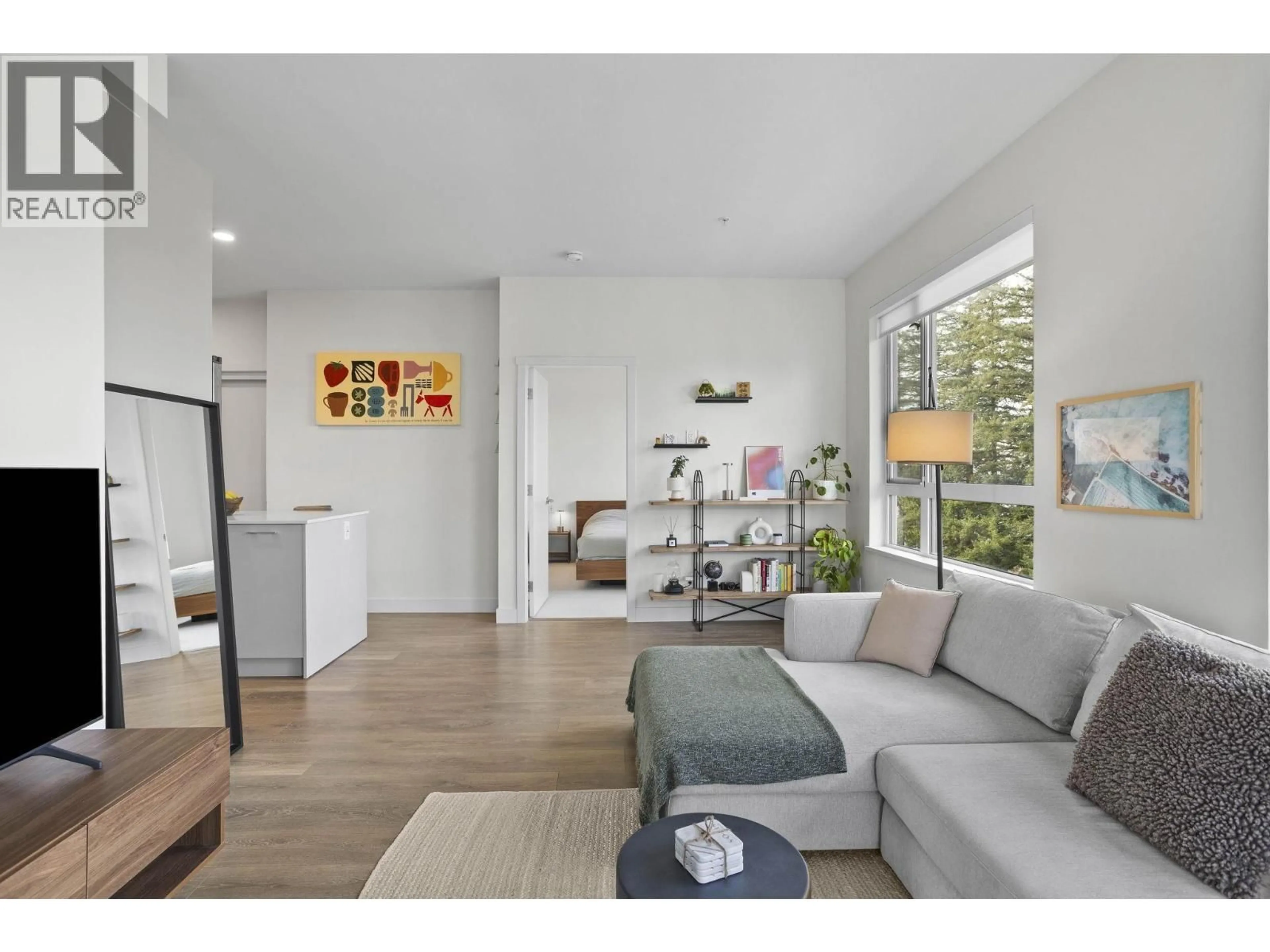 Living room with furniture, wood/laminate floor for 612 - 735 ANSKAR COURT, Coquitlam British Columbia V3J0L7