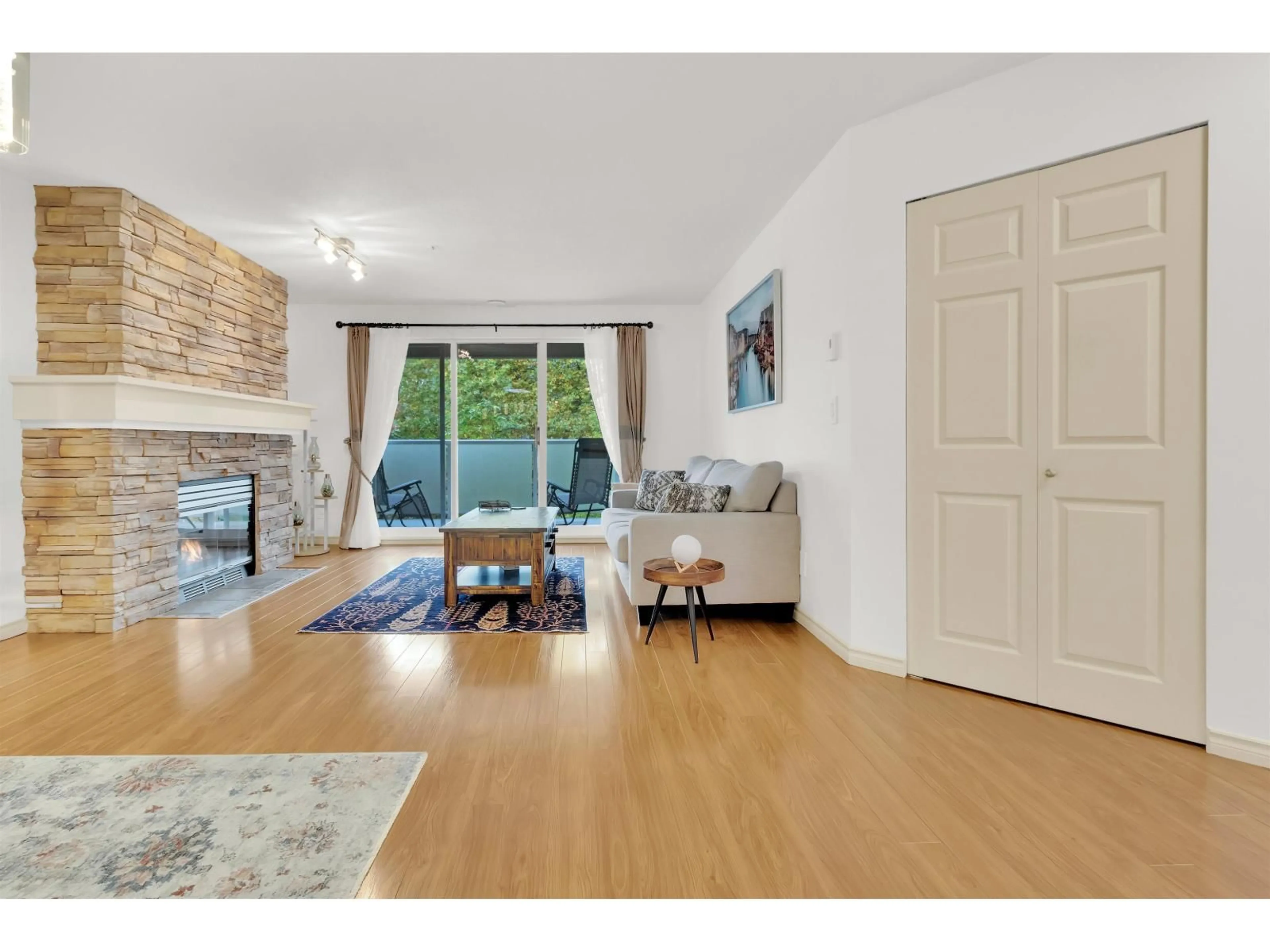 Living room with furniture, wood/laminate floor for 209 - 20145 55A AVENUE, Langley British Columbia V3A8L6