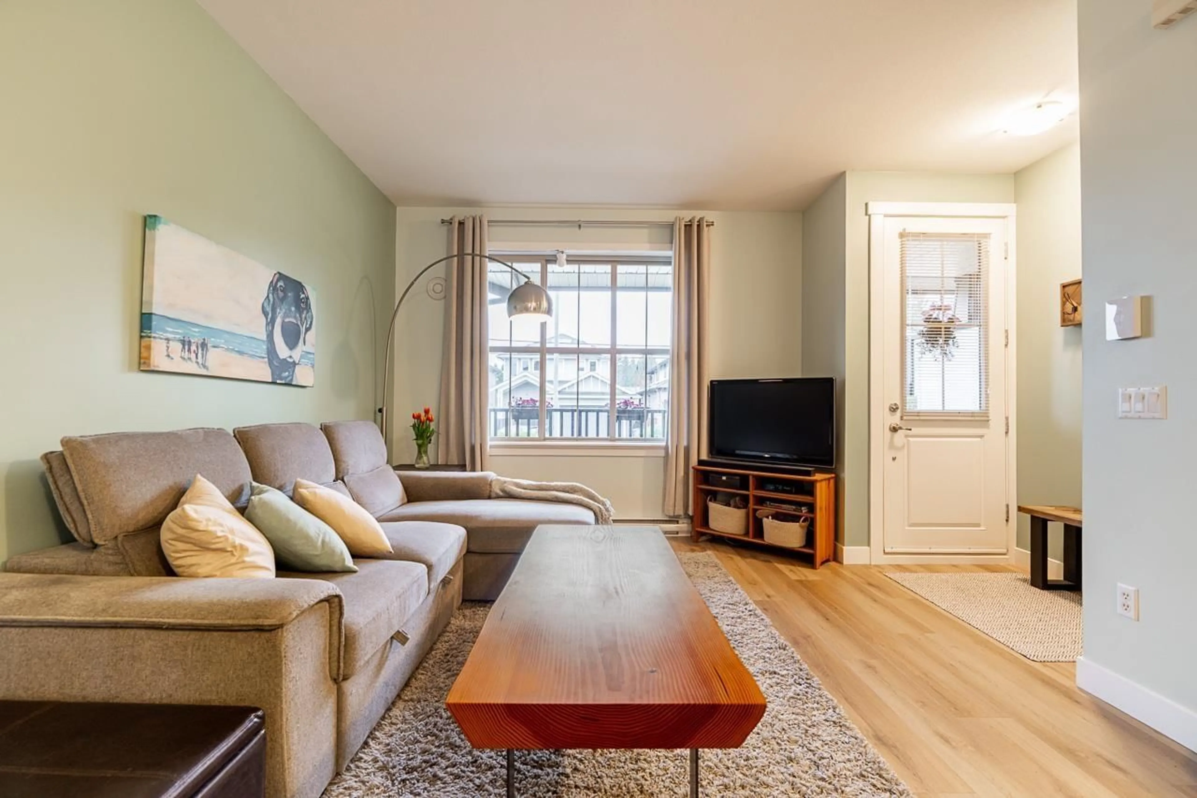 Living room with furniture, wood/laminate floor for 8 - 9525 204 STREET, Langley British Columbia V1M0B9