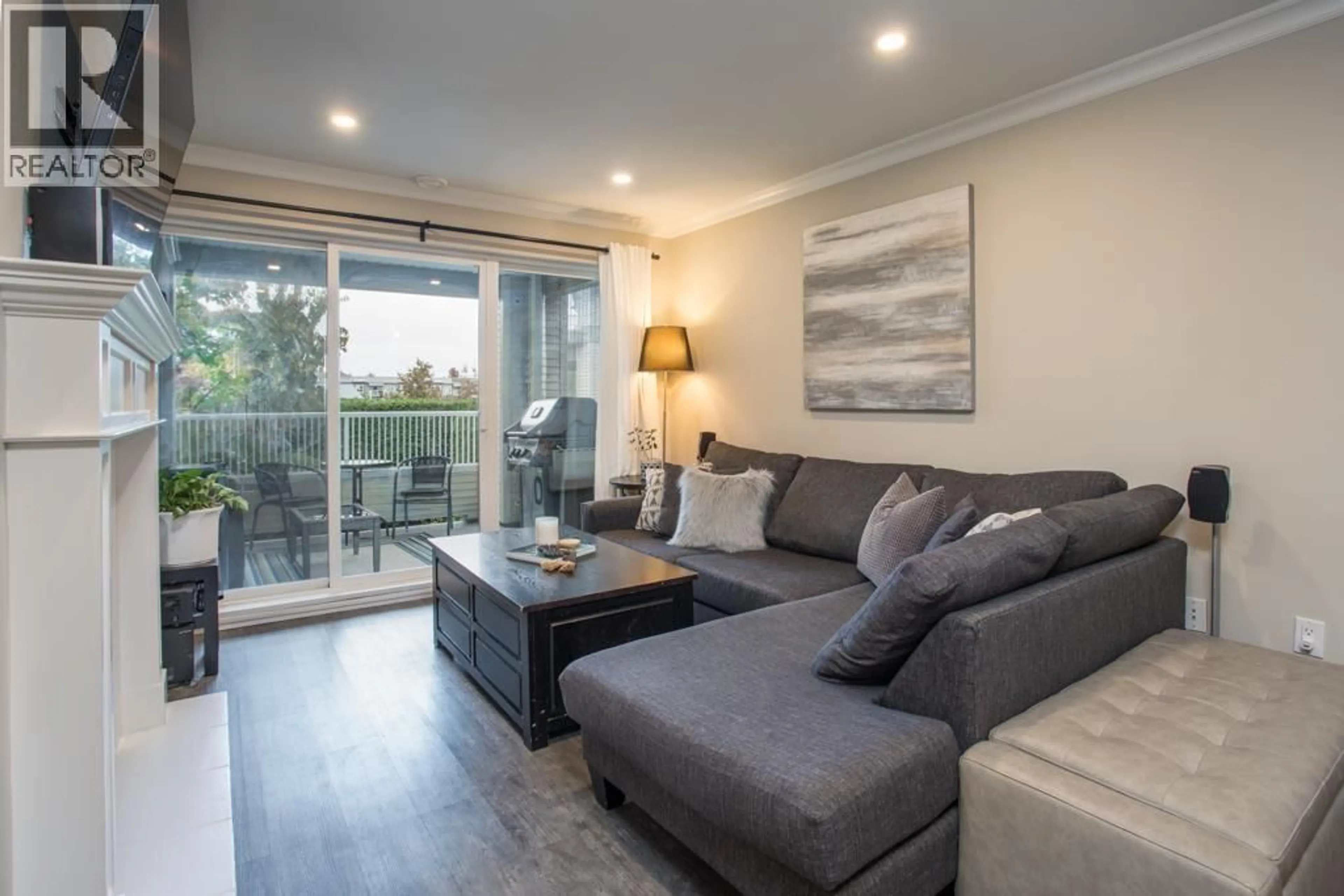 Living room with furniture, wood/laminate floor for 212 - 4770 52A STREET, Delta British Columbia V4K5B5