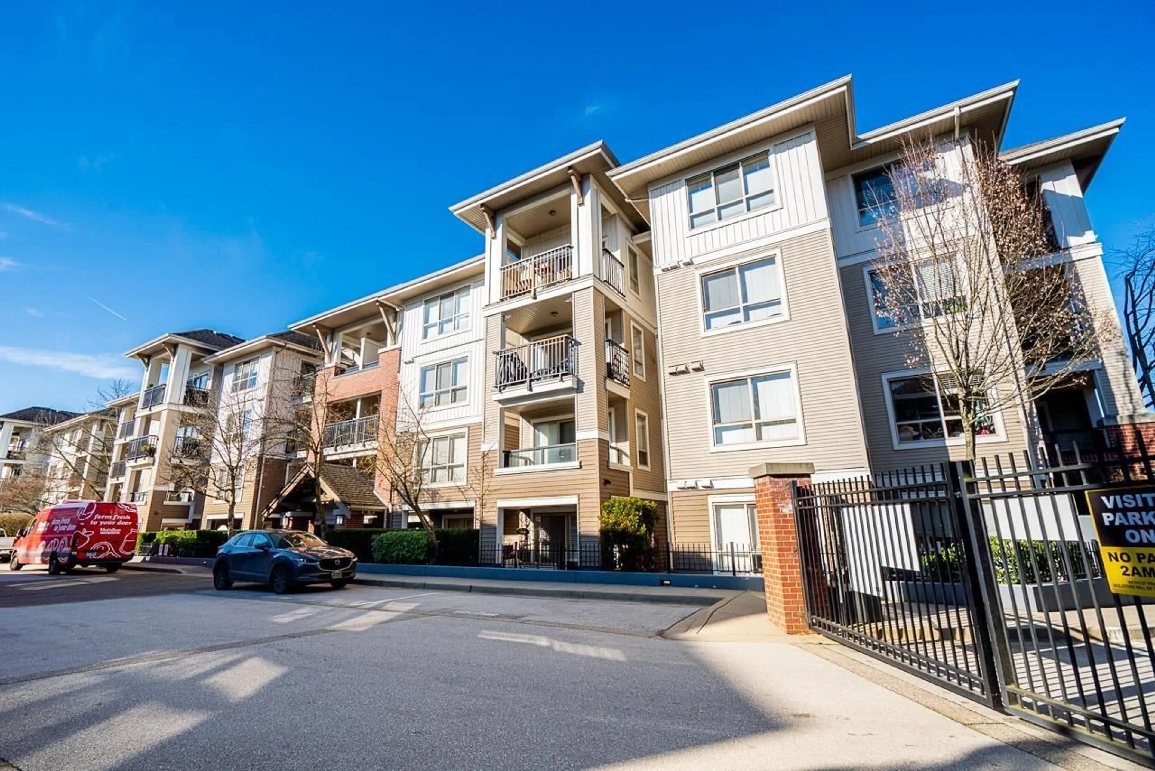 A pic from outside/outdoor area/front of a property/back of a property/a pic from drone, street for E104 - 8929 202 STREET, Langley British Columbia V1M0B4