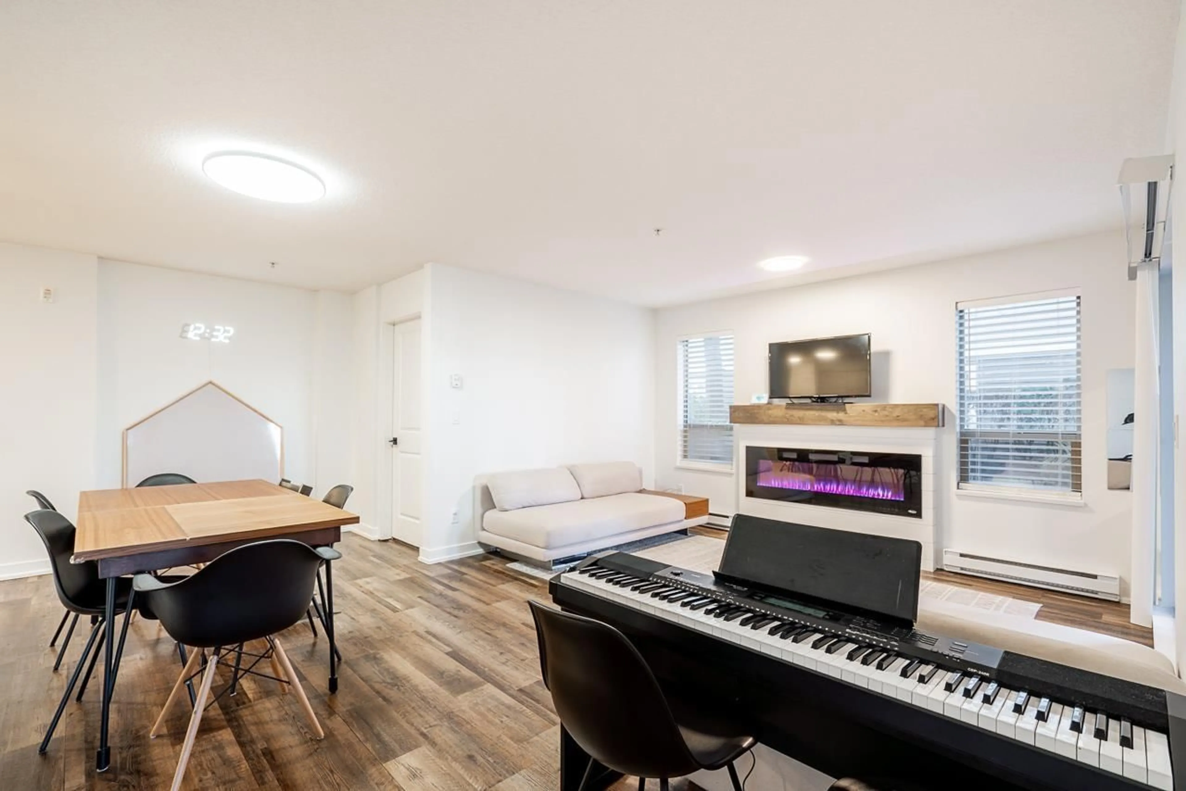 Living room with furniture, wood/laminate floor for E104 - 8929 202 STREET, Langley British Columbia V1M0B4