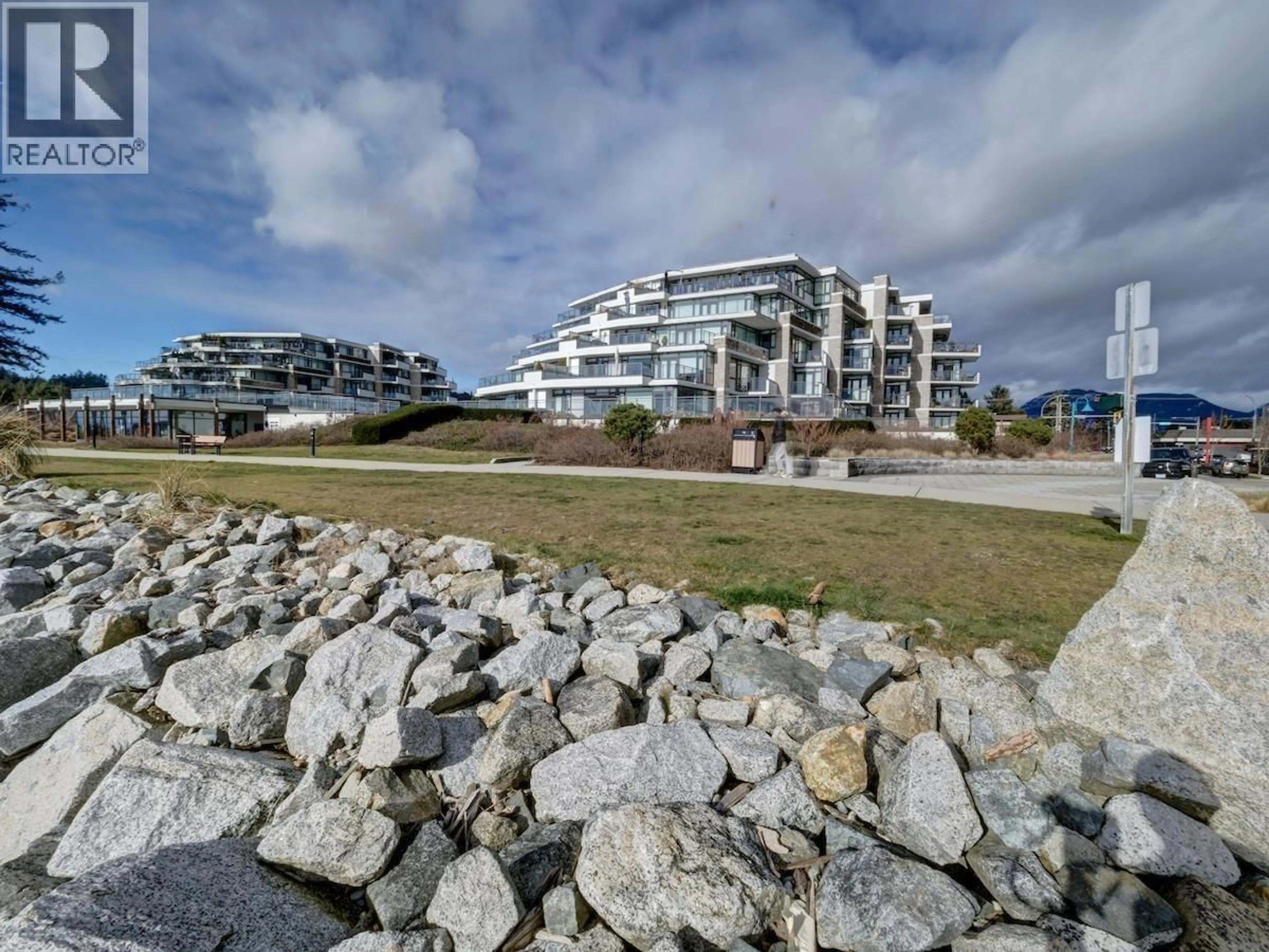 A pic from outside/outdoor area/front of a property/back of a property/a pic from drone, unknown for 206 - 5665 TEREDO STREET, Sechelt British Columbia V7Z0J2