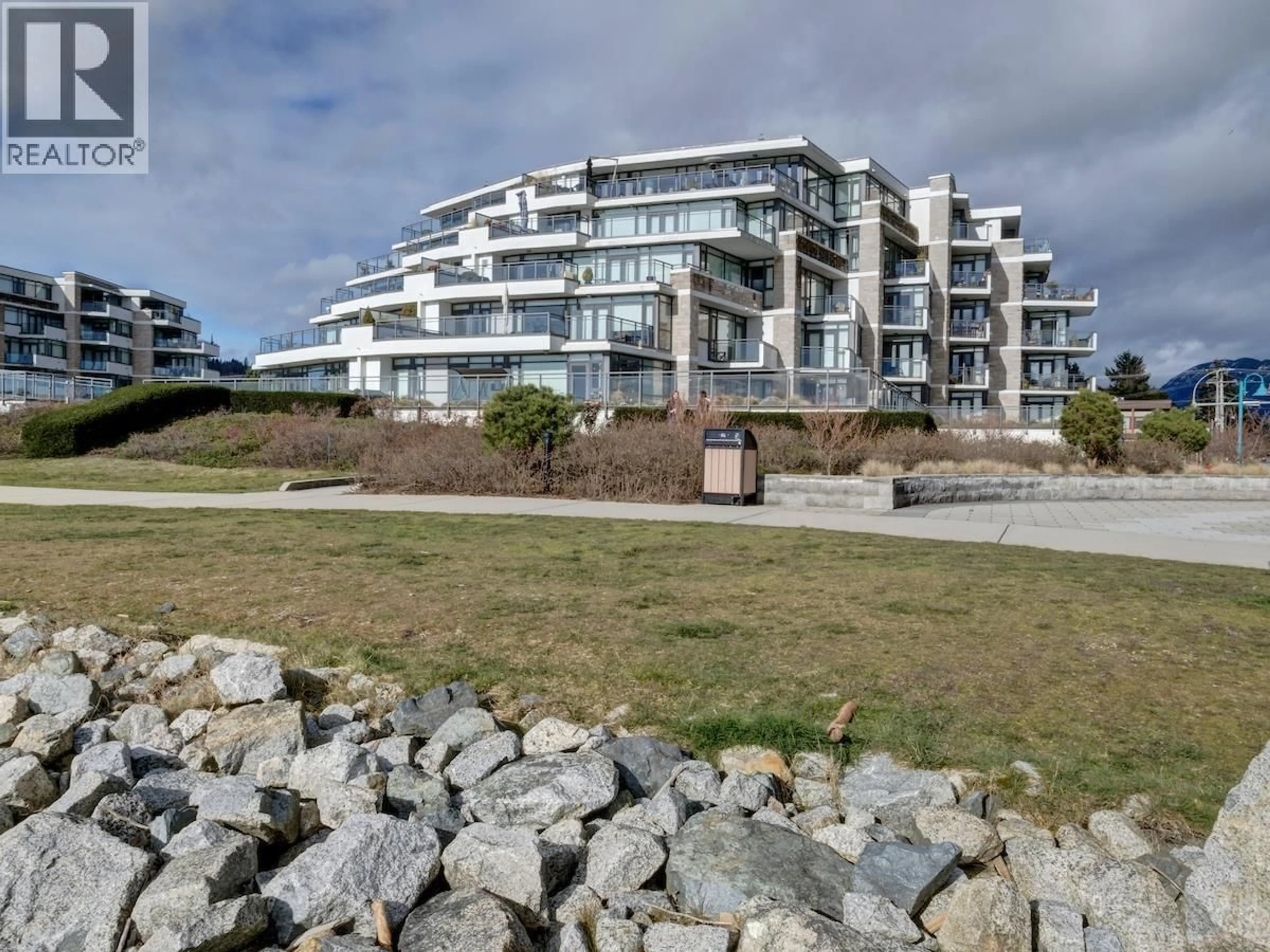 A pic from outside/outdoor area/front of a property/back of a property/a pic from drone, water/lake/river/ocean view for 206 - 5665 TEREDO STREET, Sechelt British Columbia V7Z0J2