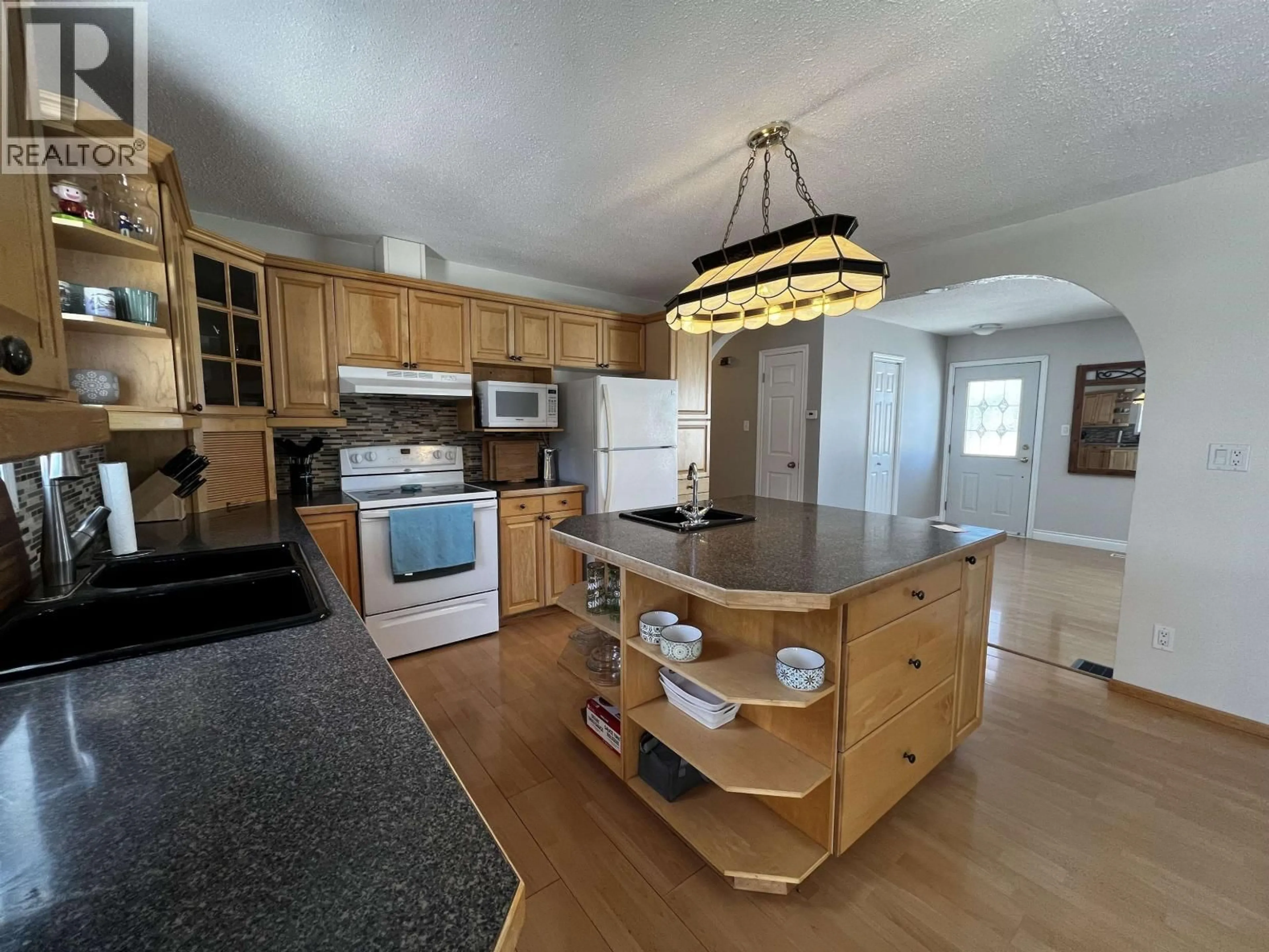 Open concept kitchen, wood/laminate floor for 194 TALUK CRESCENT, Fraser Lake British Columbia V0J1S0