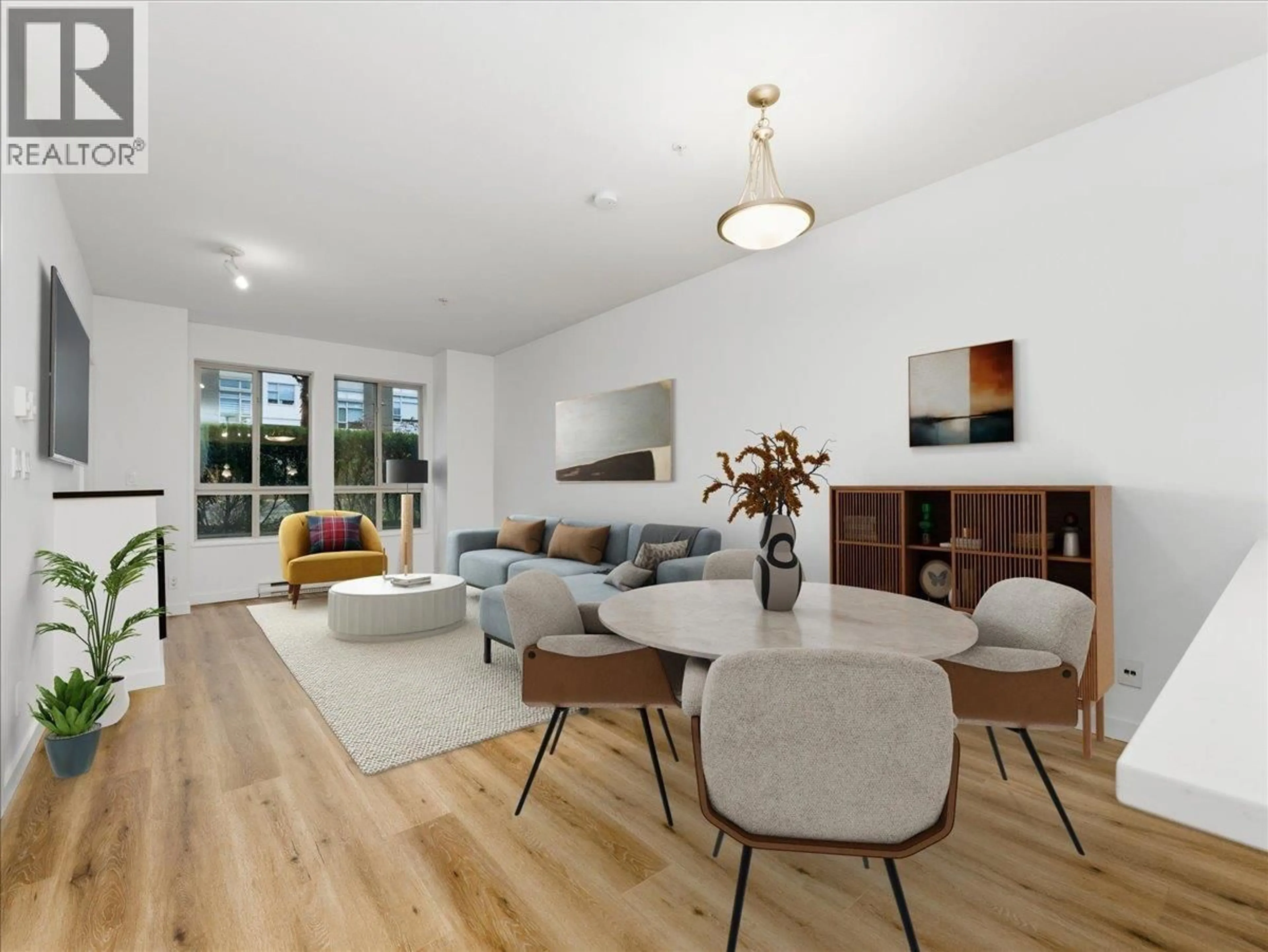 Living room with furniture, wood/laminate floor for 103 - 225 FRANCIS WAY, New Westminster British Columbia V3L0G1