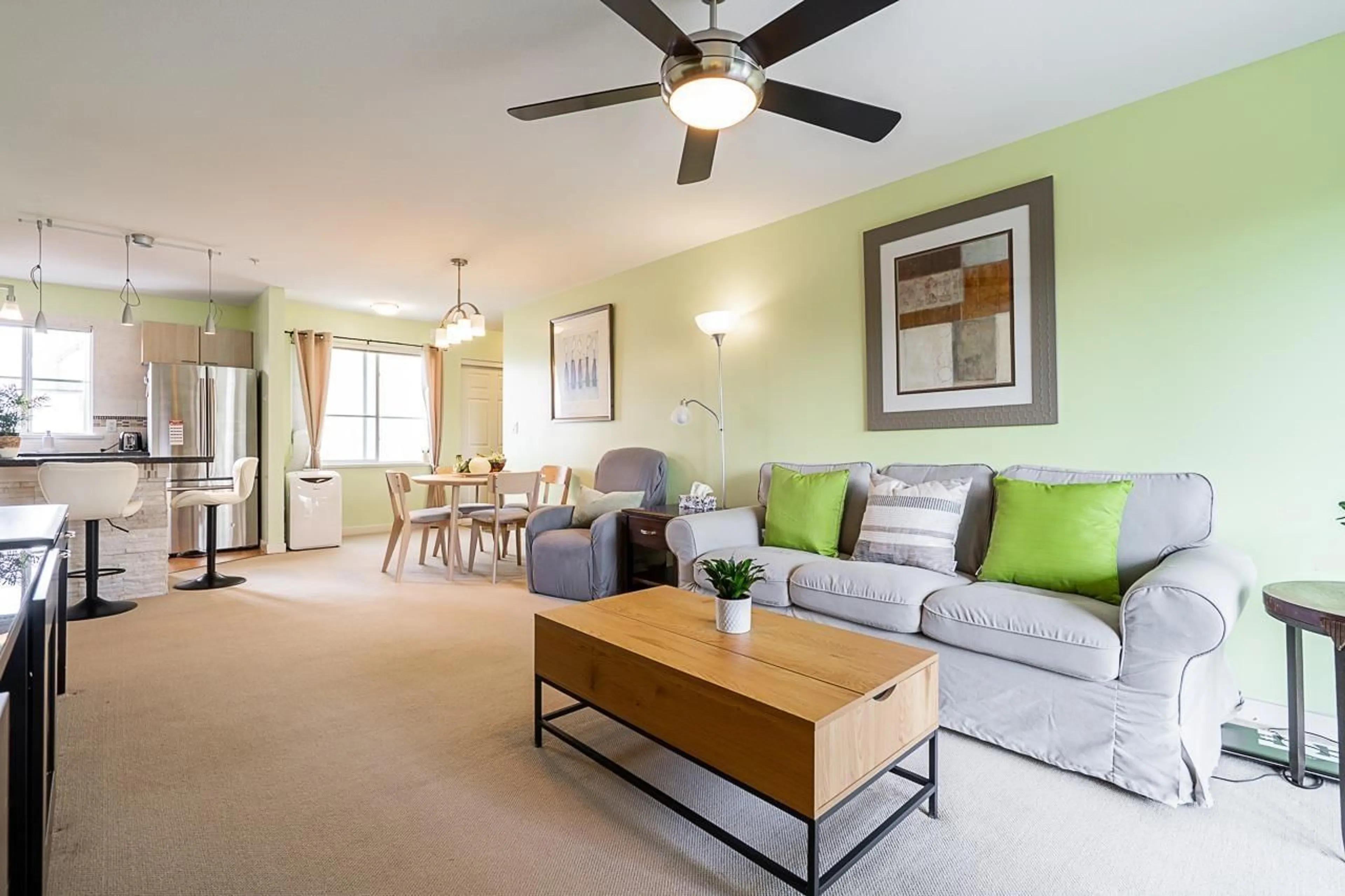 Living room with furniture, wood/laminate floor for 306 - 12083 92A AVENUE, Surrey British Columbia V3V8C8