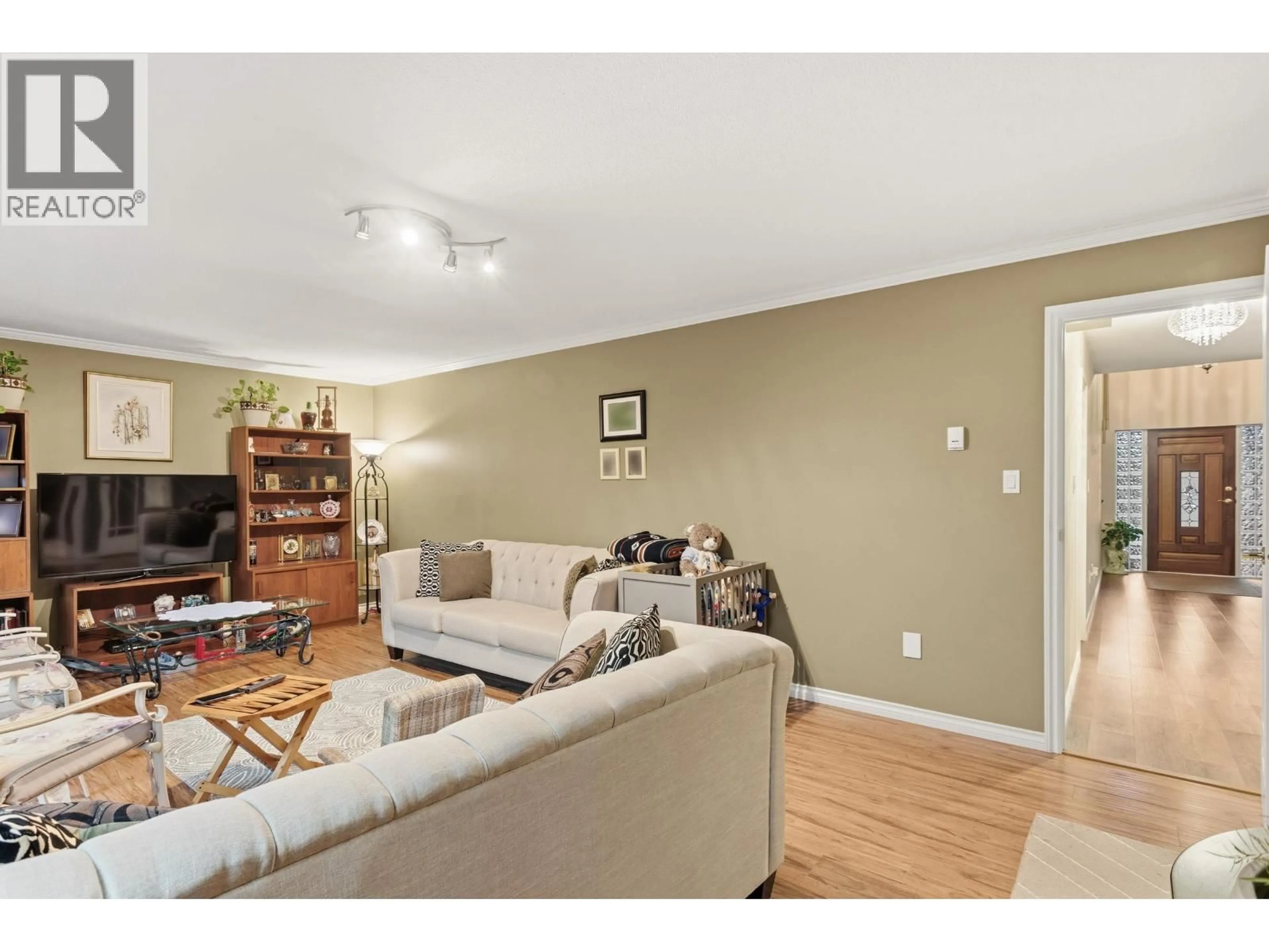 Living room with furniture, wood/laminate floor for 4729 CANADA WAY, Burnaby British Columbia V5G1L3