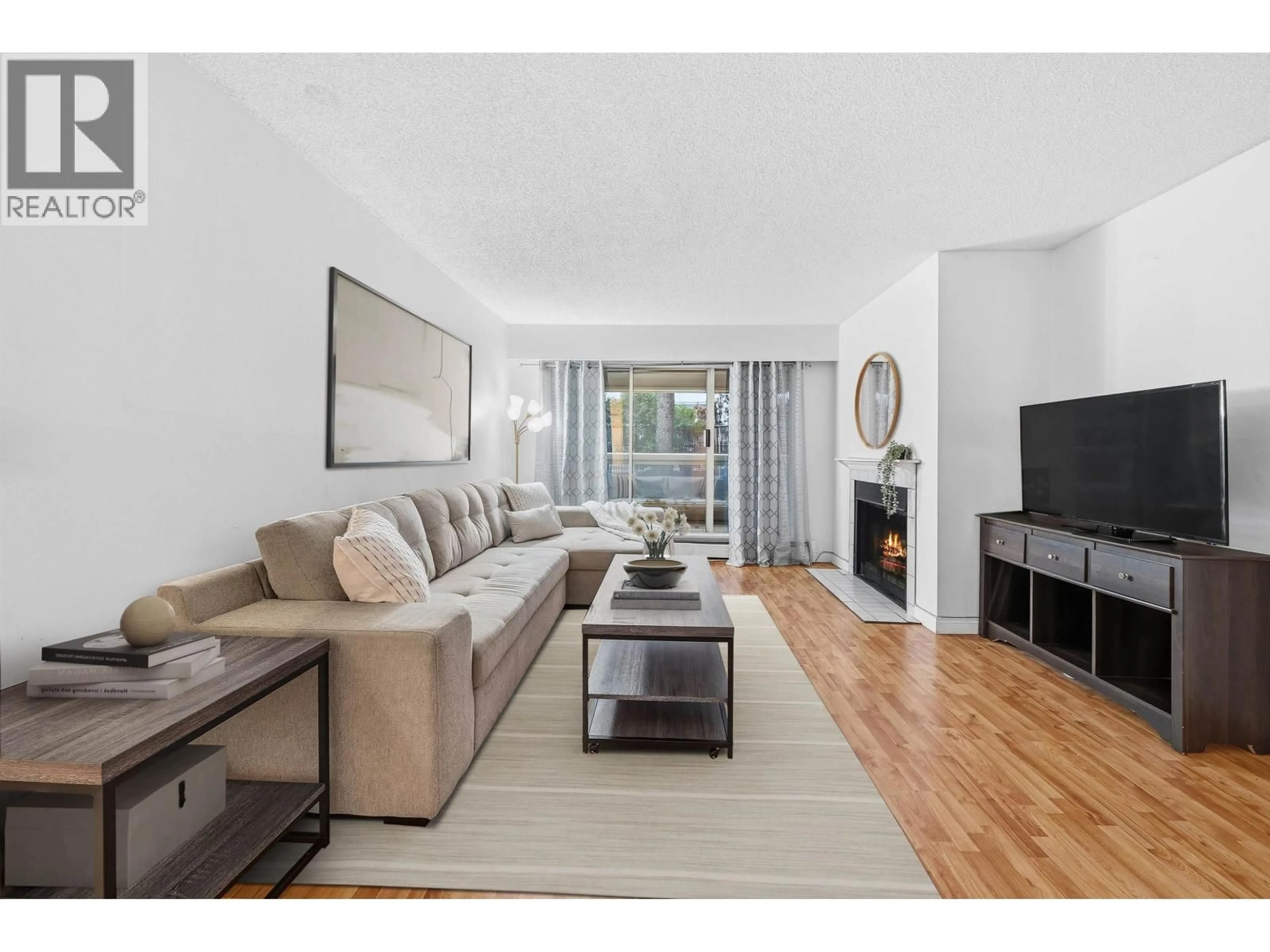 Living room with furniture, wood/laminate floor for 105 - 932 ROBINSON STREET, Coquitlam British Columbia V3J7R8