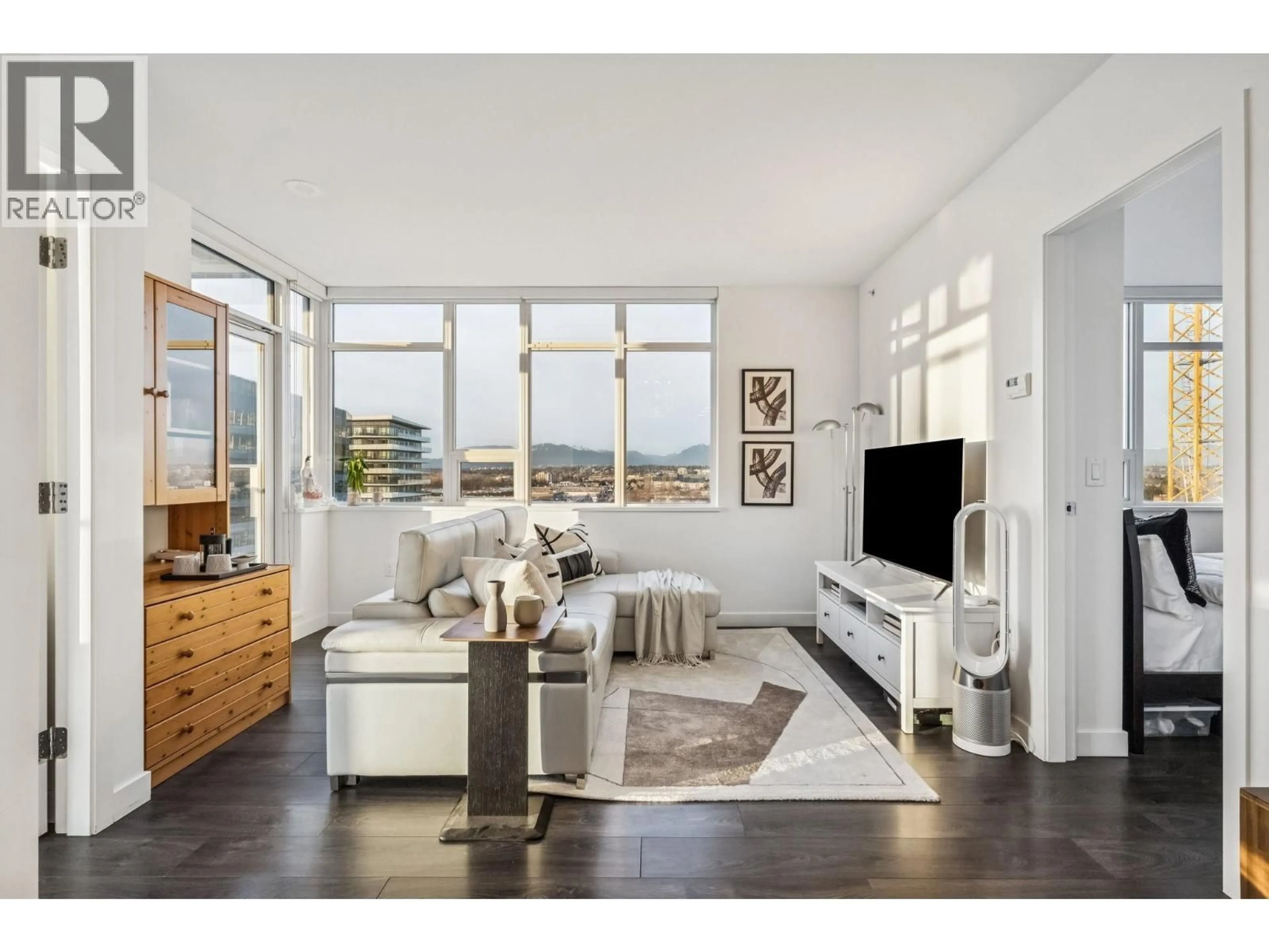 Living room with furniture, wood/laminate floor for 1209 - 5580 NO. 3 ROAD, Richmond British Columbia V6X0R8