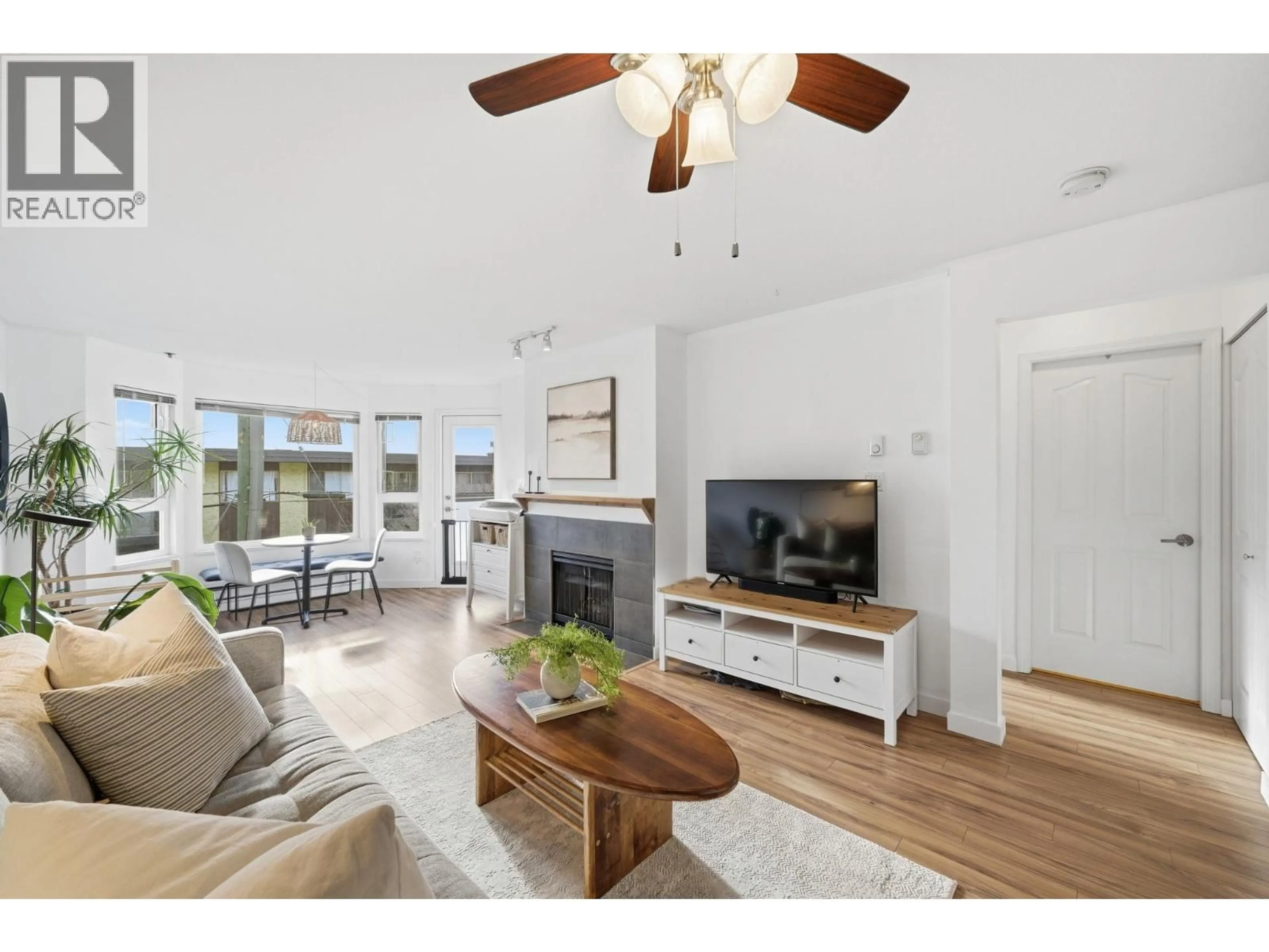 Living room with furniture, wood/laminate floor for 204 - 315 3RD STREET, North Vancouver British Columbia V7L1G1