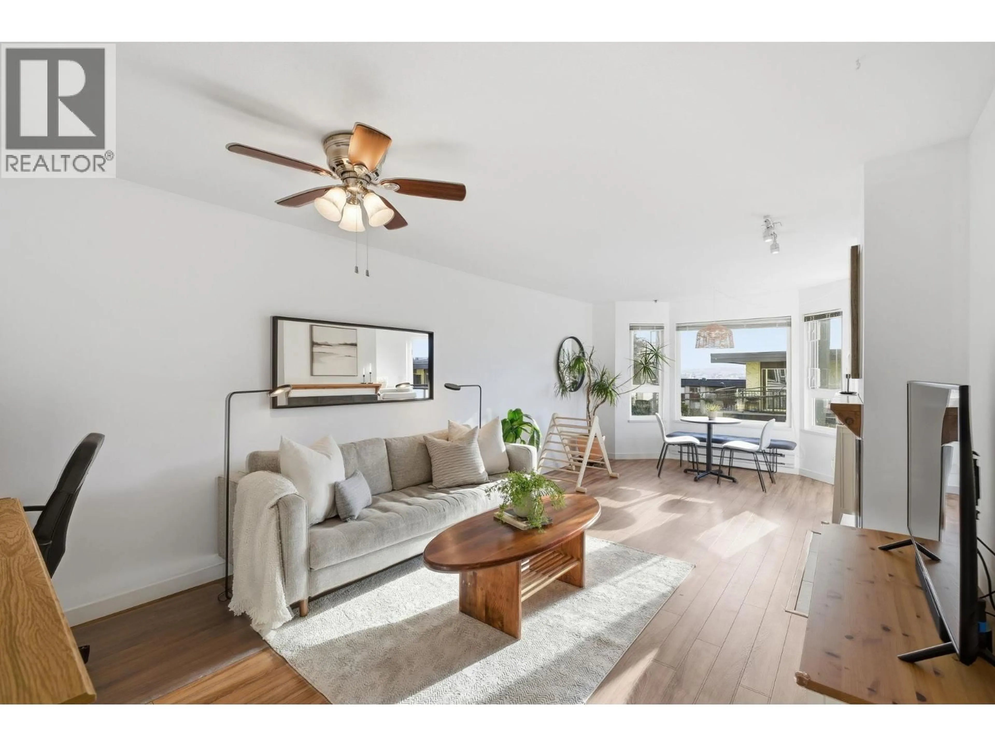 Living room with furniture, wood/laminate floor for 204 - 315 3RD STREET, North Vancouver British Columbia V7L1G1