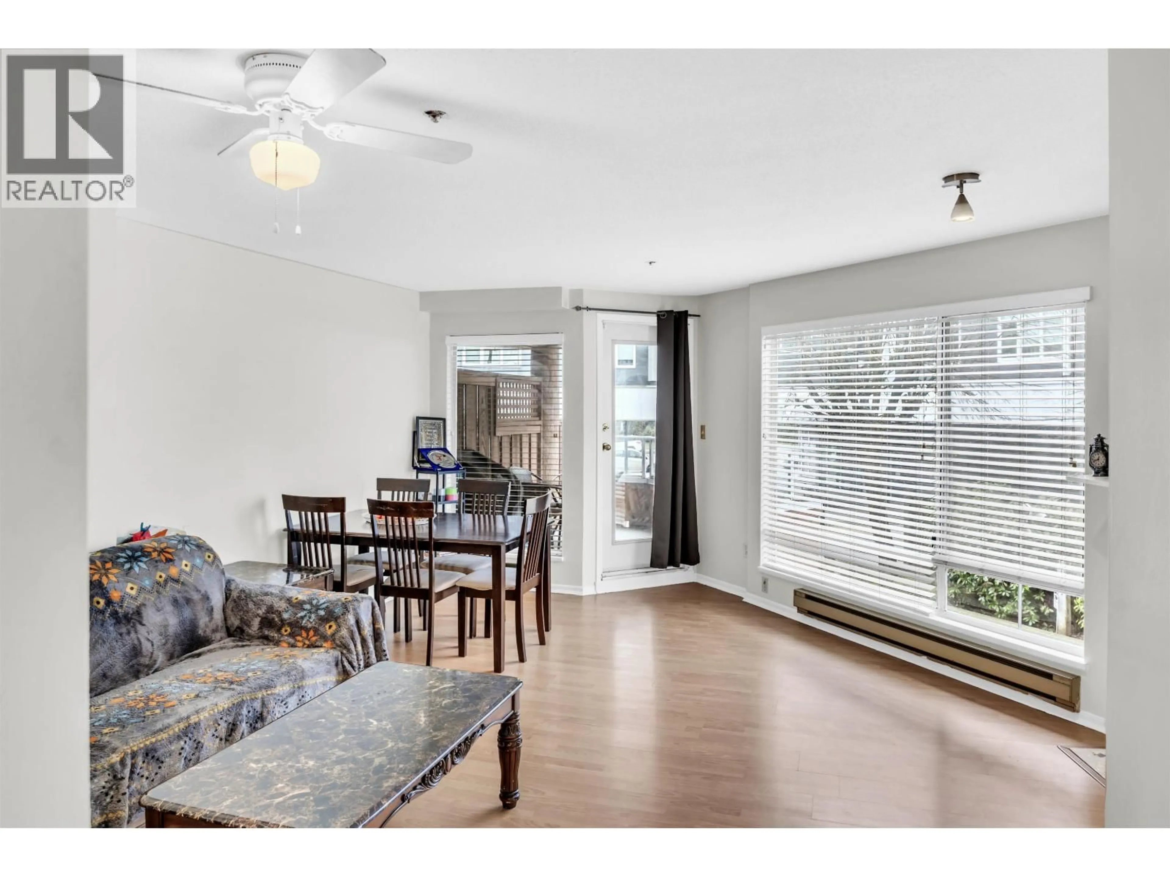 Living room with furniture, wood/laminate floor for 212 - 6939 GILLEY AVENUE, Burnaby British Columbia V5J4W8