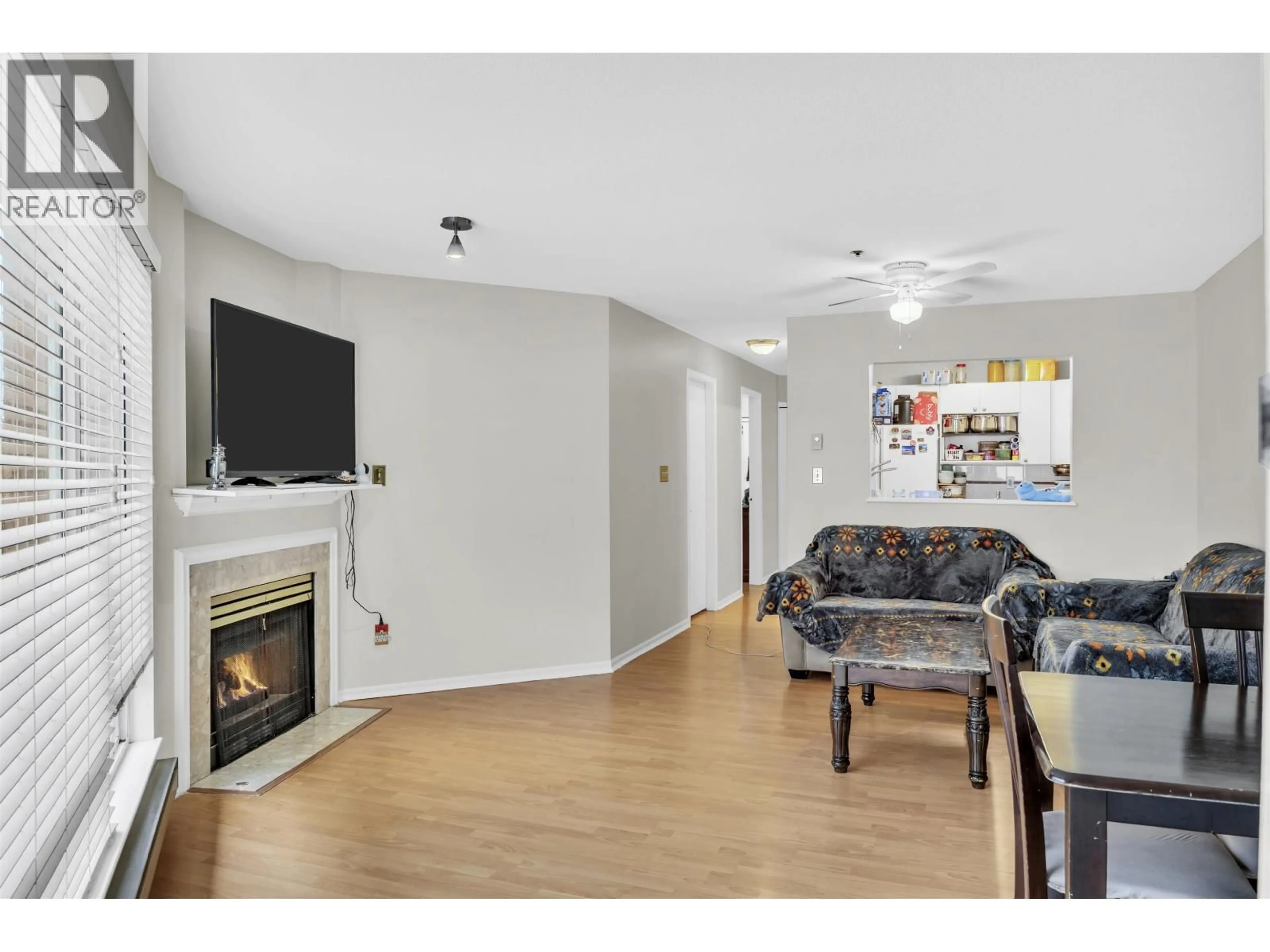 Living room with furniture, wood/laminate floor for 212 - 6939 GILLEY AVENUE, Burnaby British Columbia V5J4W8