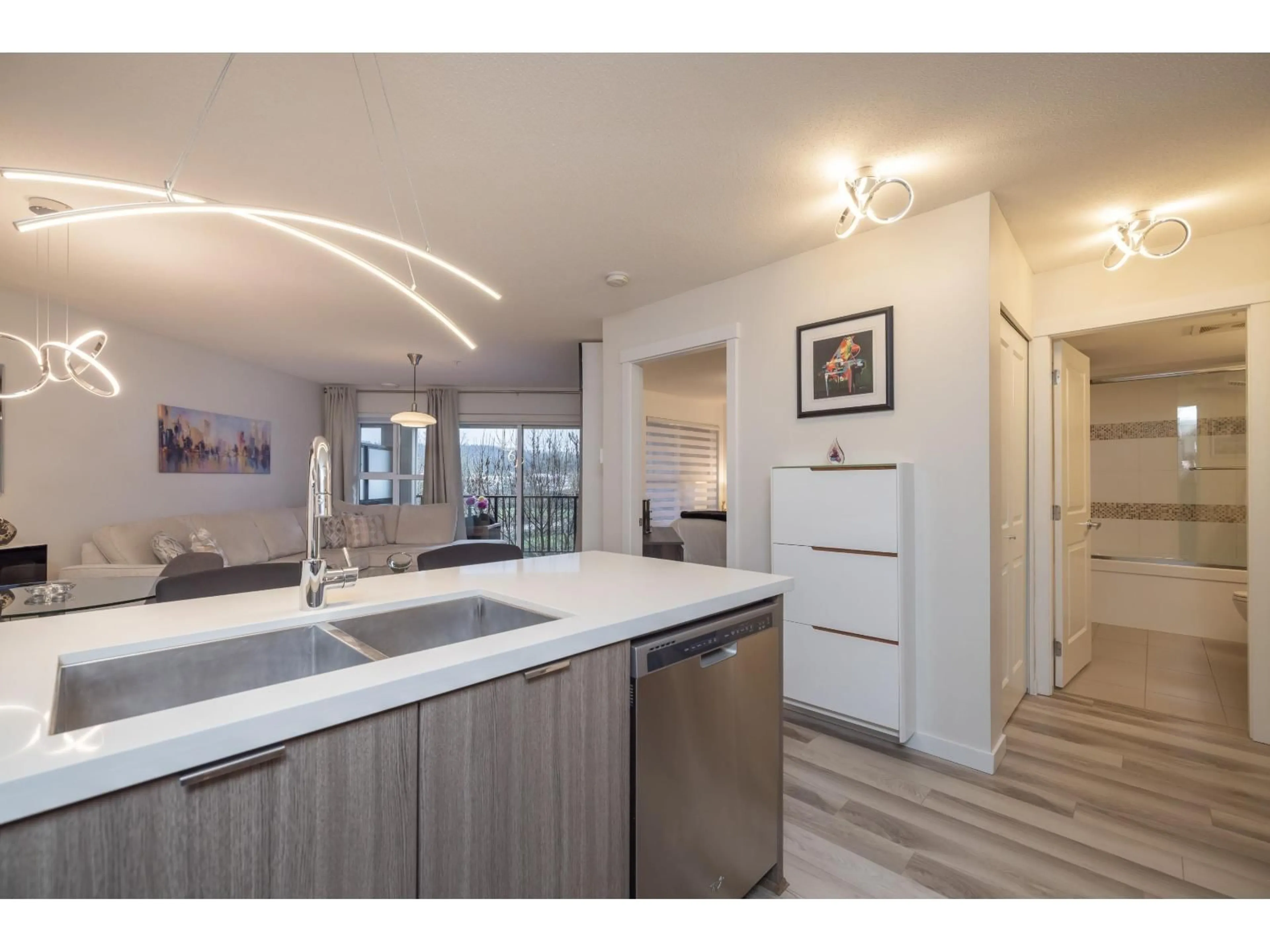 Open concept kitchen, wood/laminate floor for 314 - 3323 151 STREET, Surrey British Columbia V3Z0L3