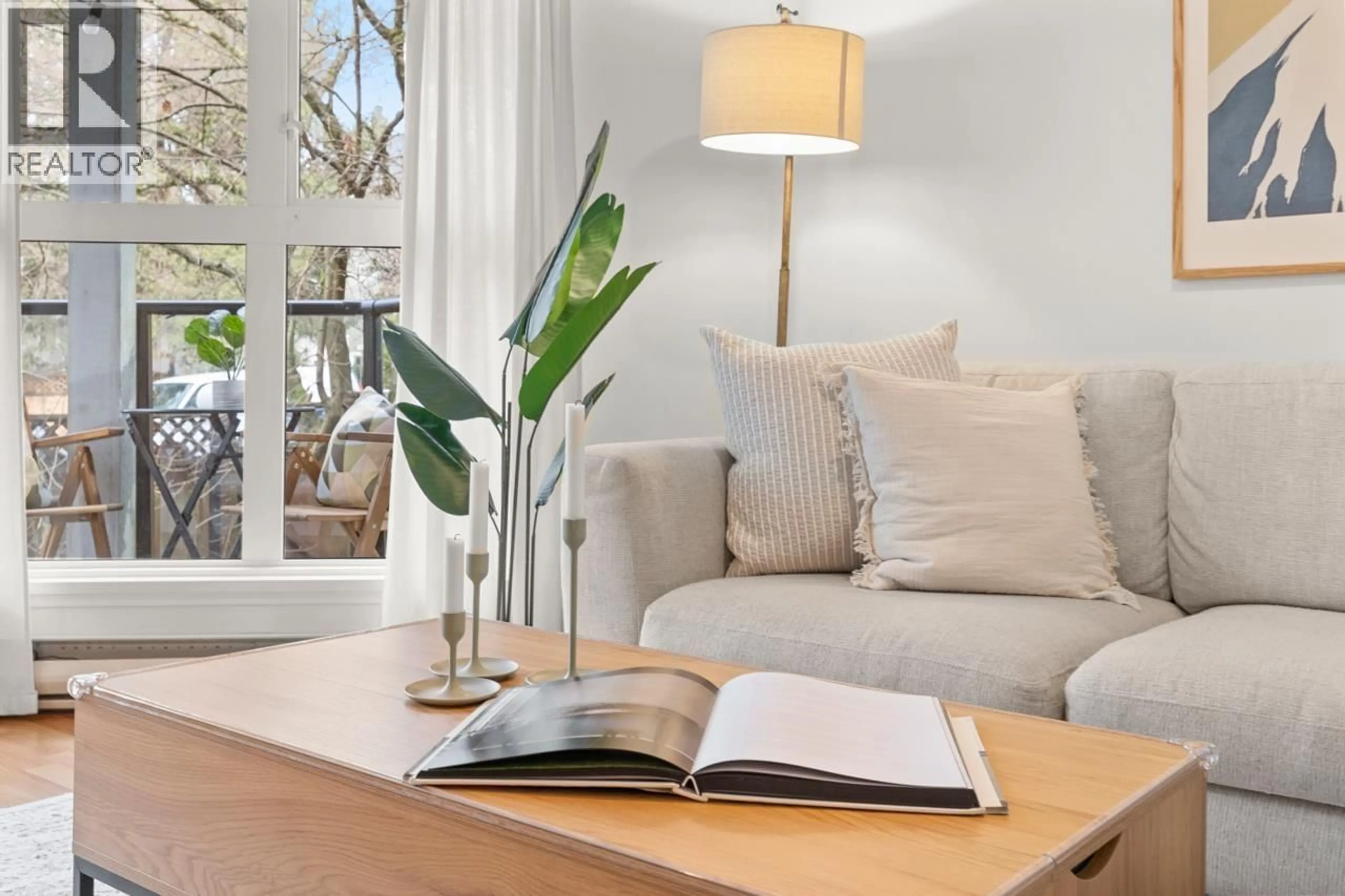 Living room with furniture, wood/laminate floor for 205 - 2212 OXFORD STREET, Vancouver British Columbia V5L1G1