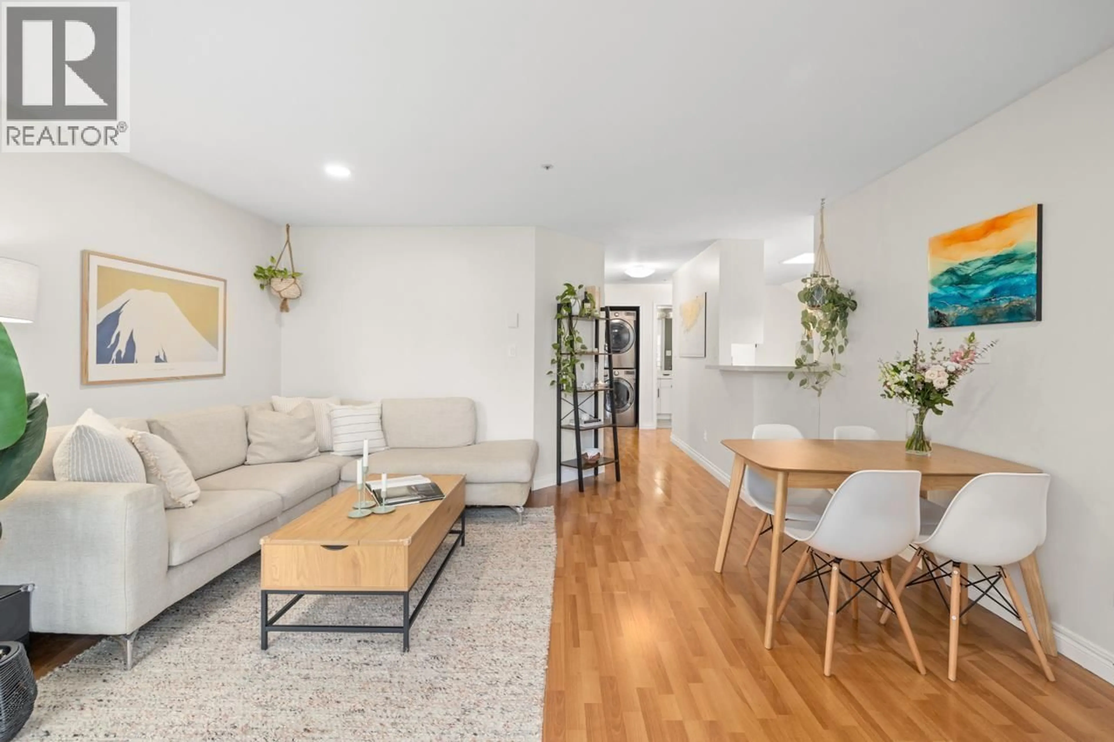 Living room with furniture, wood/laminate floor for 205 - 2212 OXFORD STREET, Vancouver British Columbia V5L1G1