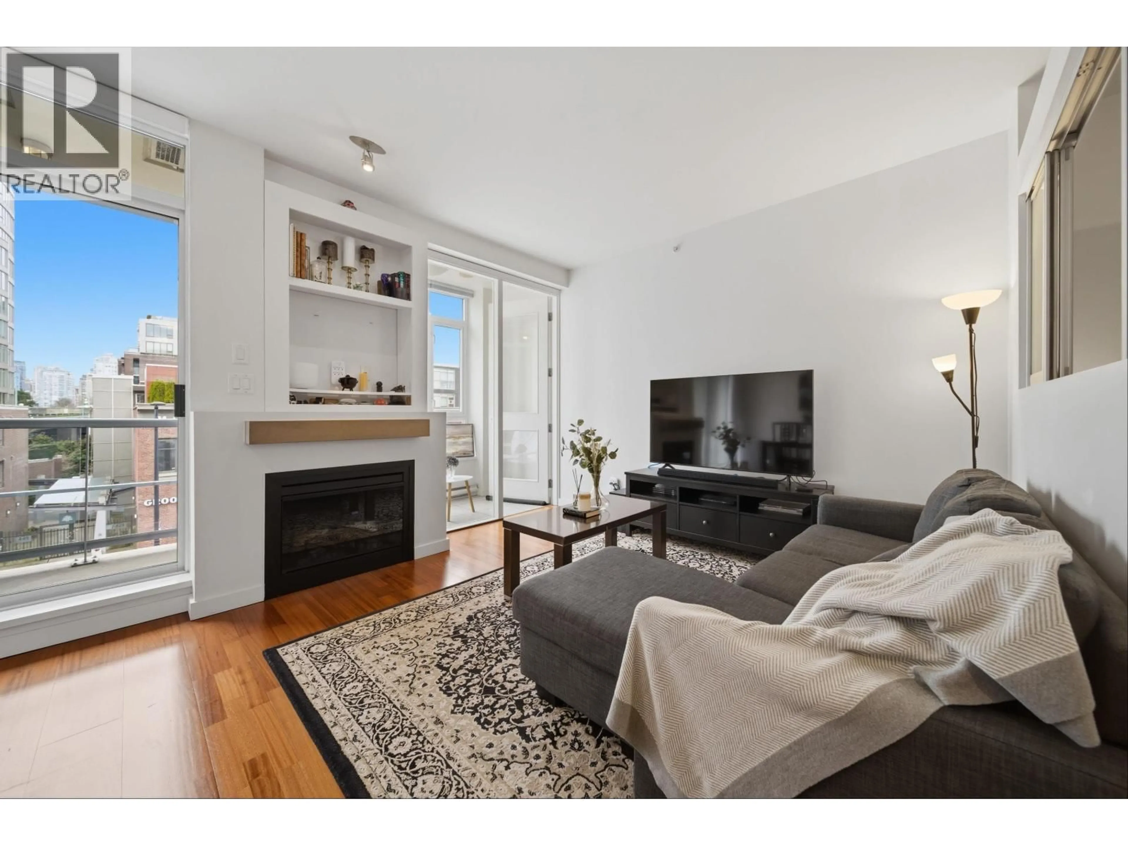 Living room with furniture, wood/laminate floor for 306 - 2055 YUKON STREET, Vancouver British Columbia V5Y4B7