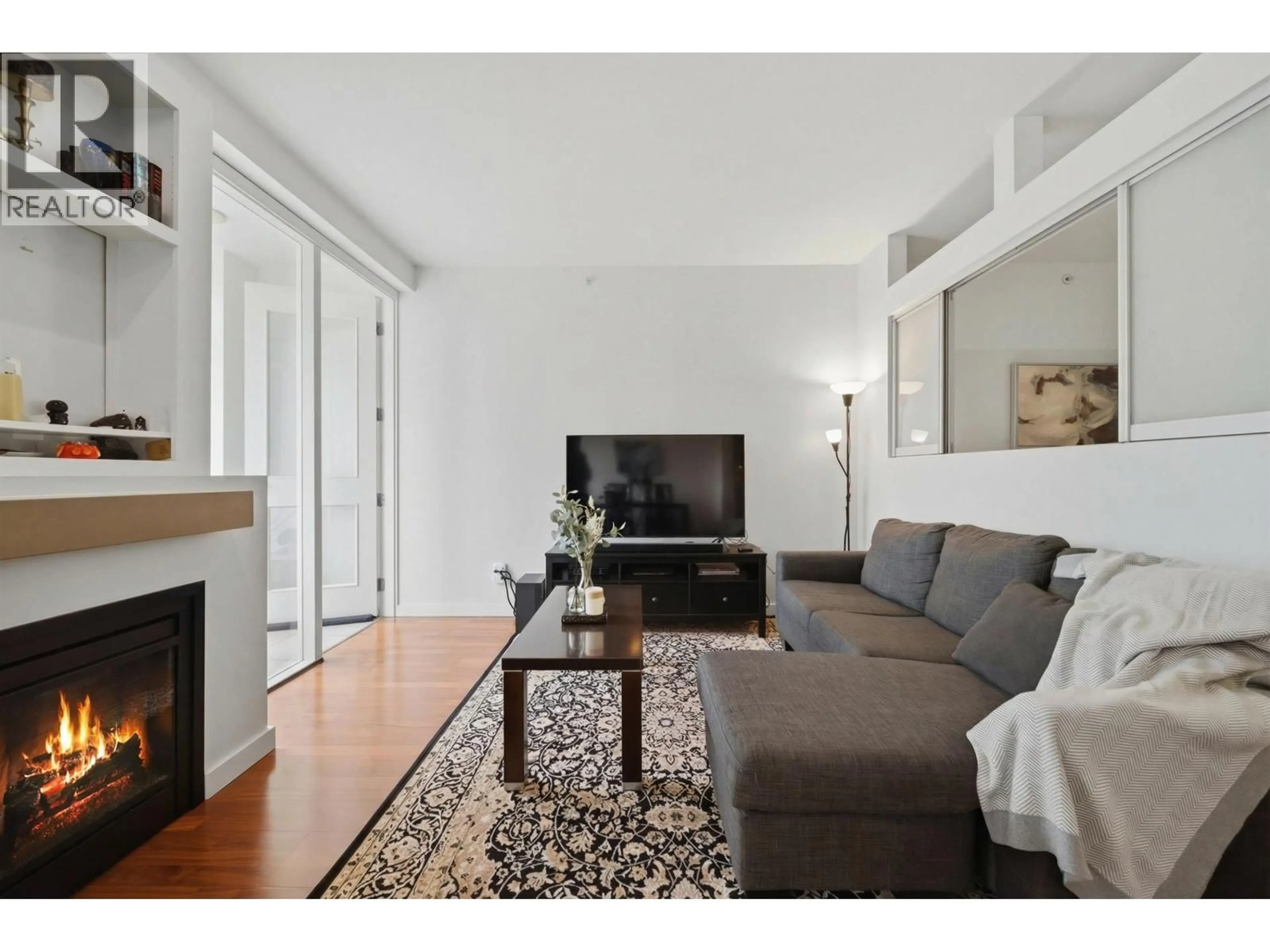 Living room with furniture, wood/laminate floor for 306 - 2055 YUKON STREET, Vancouver British Columbia V5Y4B7