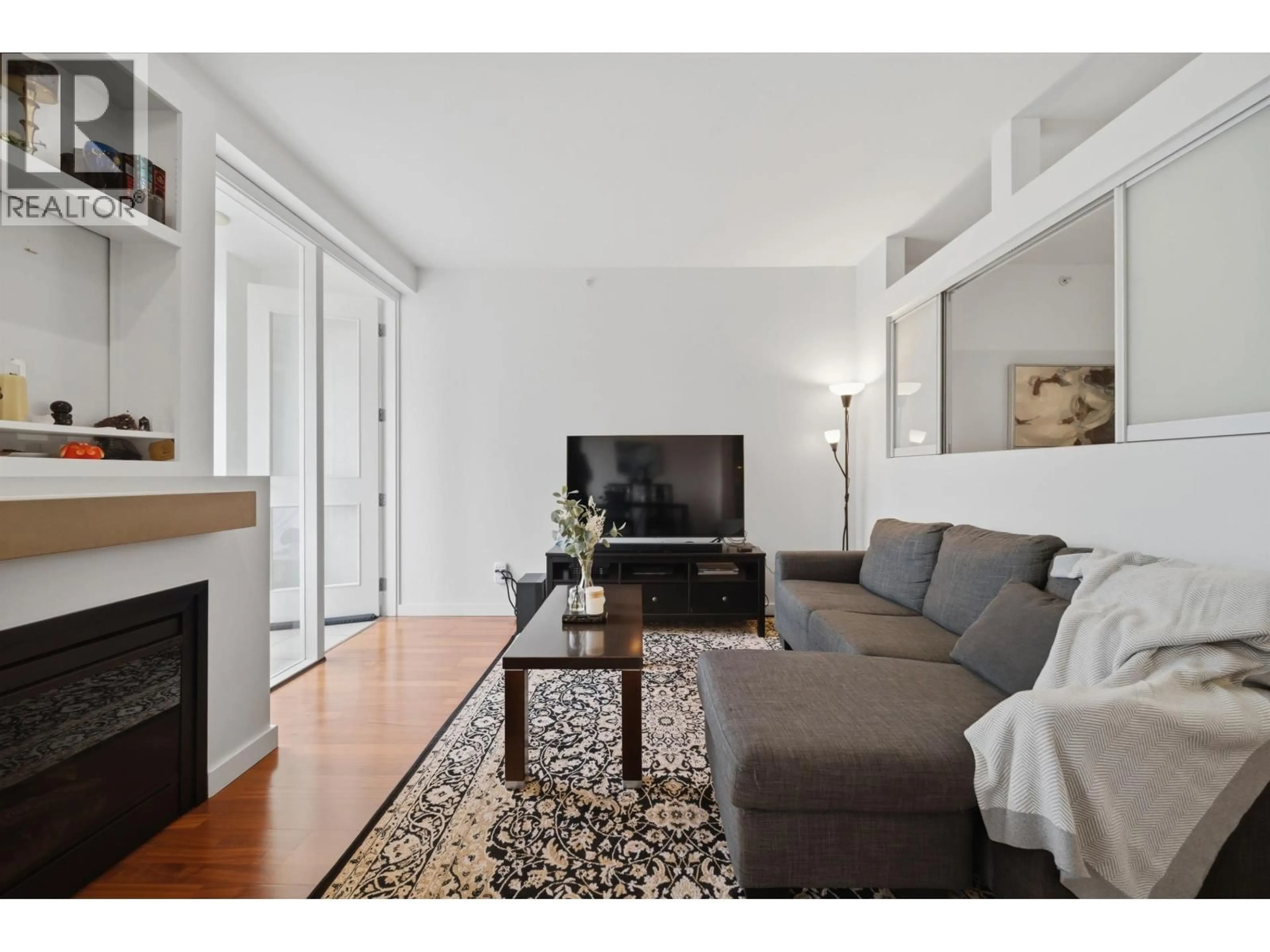 Living room with furniture, wood/laminate floor for 306 - 2055 YUKON STREET, Vancouver British Columbia V5Y4B7
