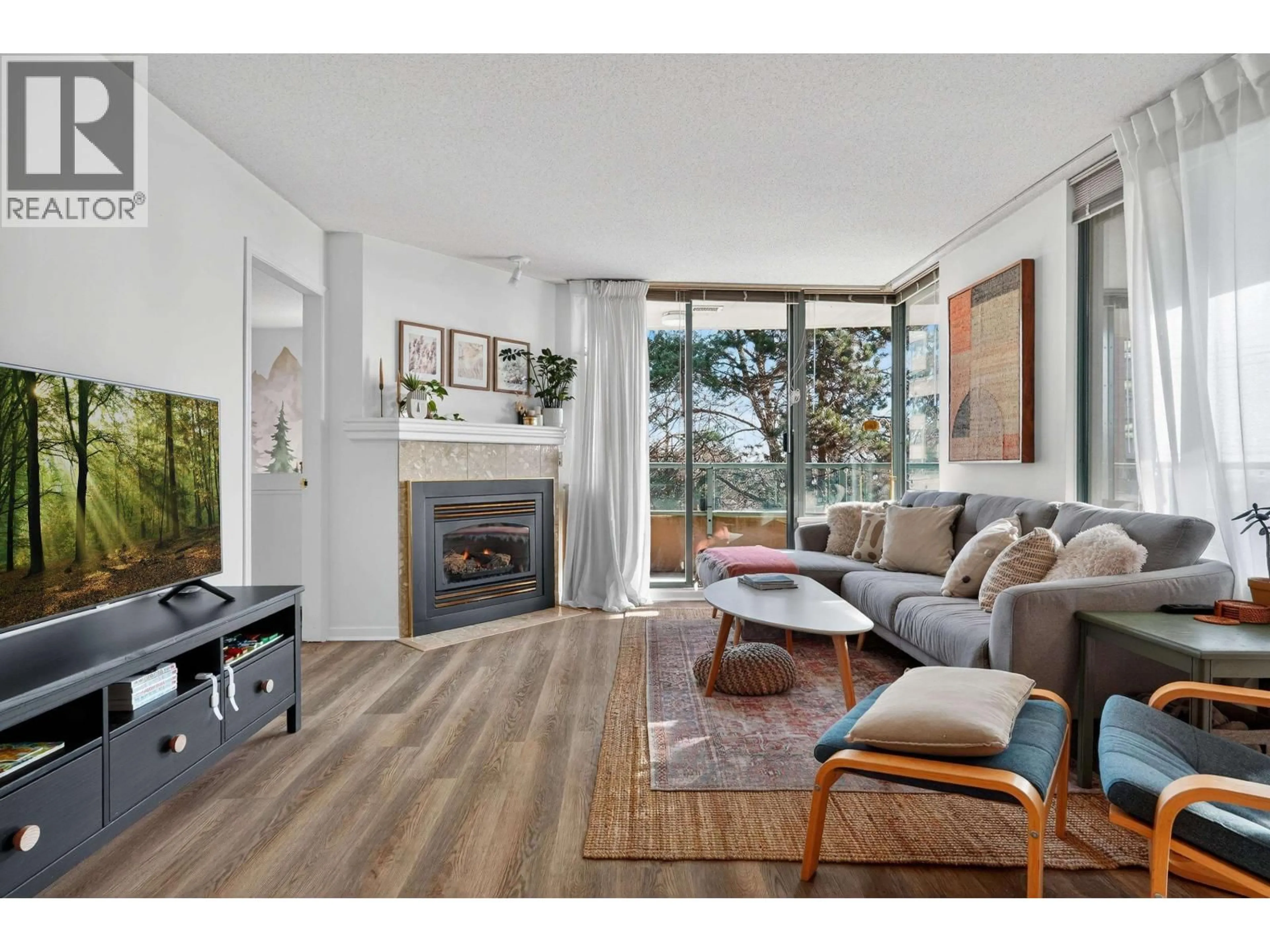 Living room with furniture, wood/laminate floor for 410 - 7288 ACORN AVENUE, Burnaby British Columbia V5E4H6