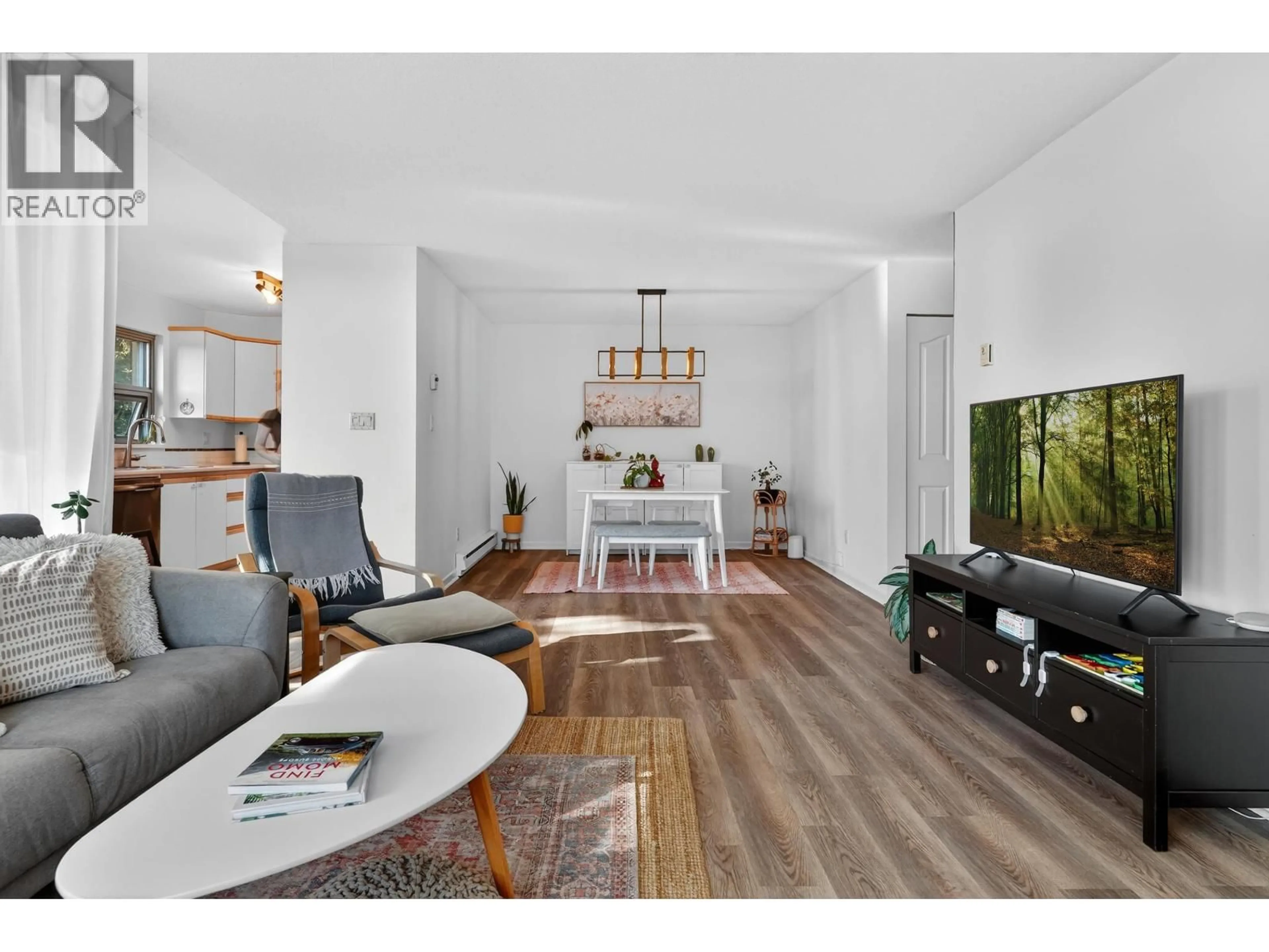 Living room with furniture, wood/laminate floor for 410 - 7288 ACORN AVENUE, Burnaby British Columbia V5E4H6