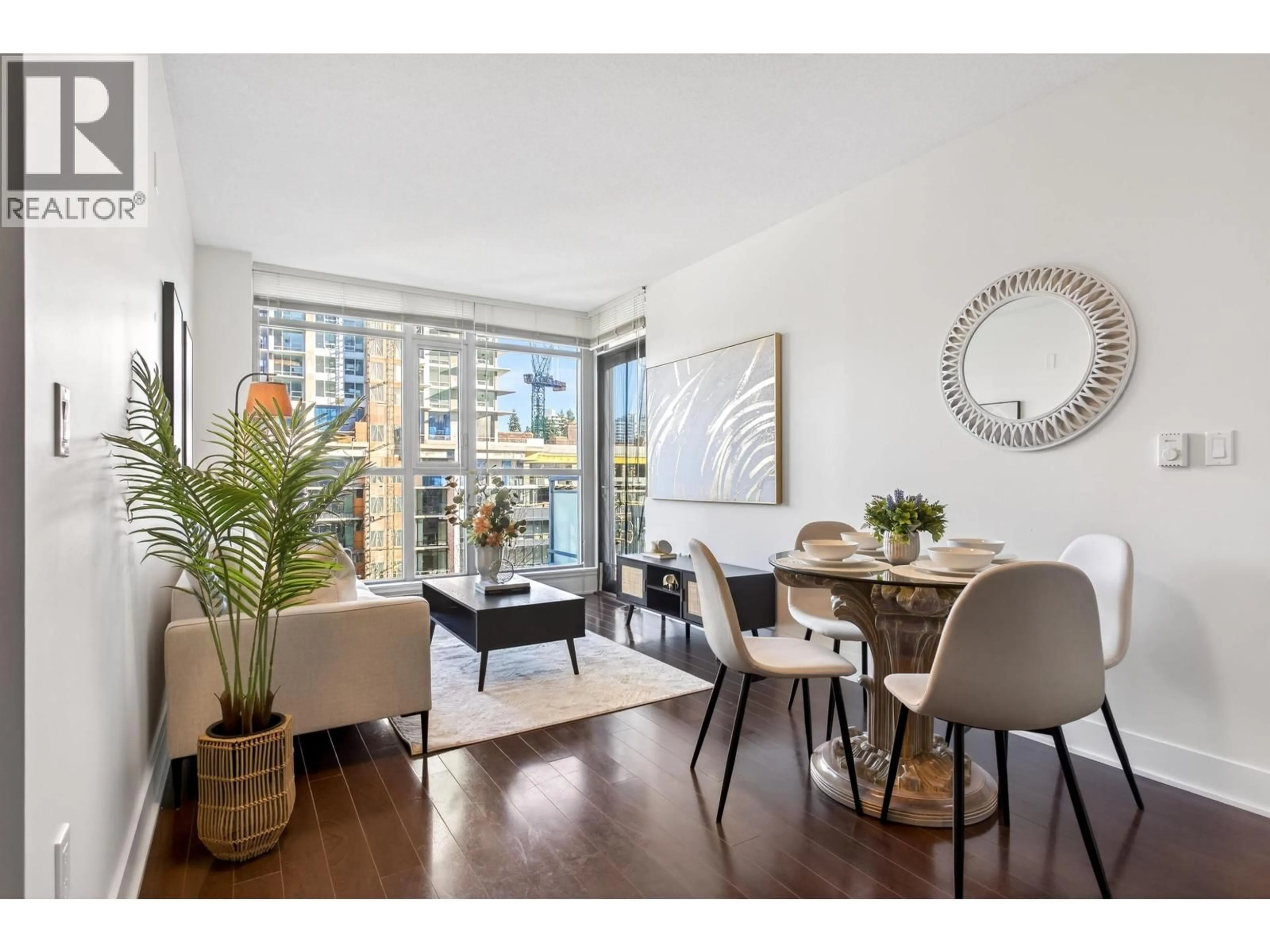 Living room with furniture, wood/laminate floor for 806 - 3008 GLEN DRIVE, Coquitlam British Columbia V3B0J5