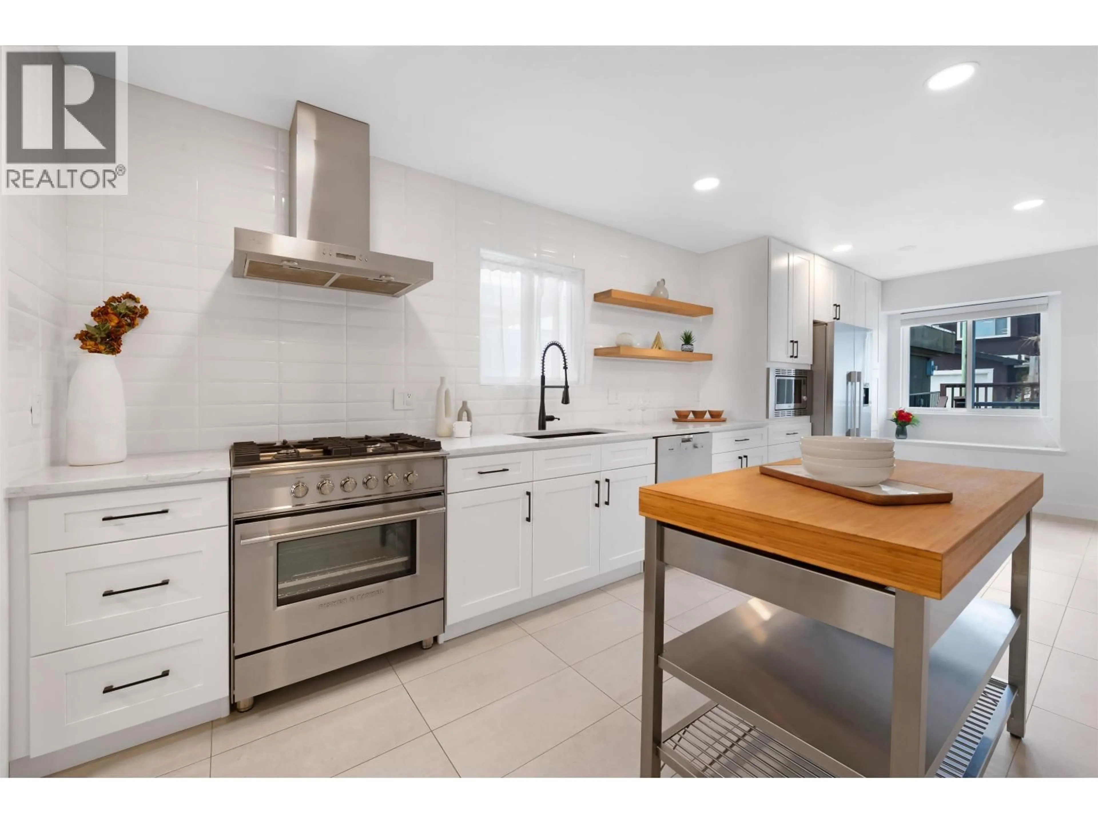 Open concept kitchen, ceramic/tile floor for 65 ELLESMERE AVENUE, Burnaby British Columbia V5B3S5