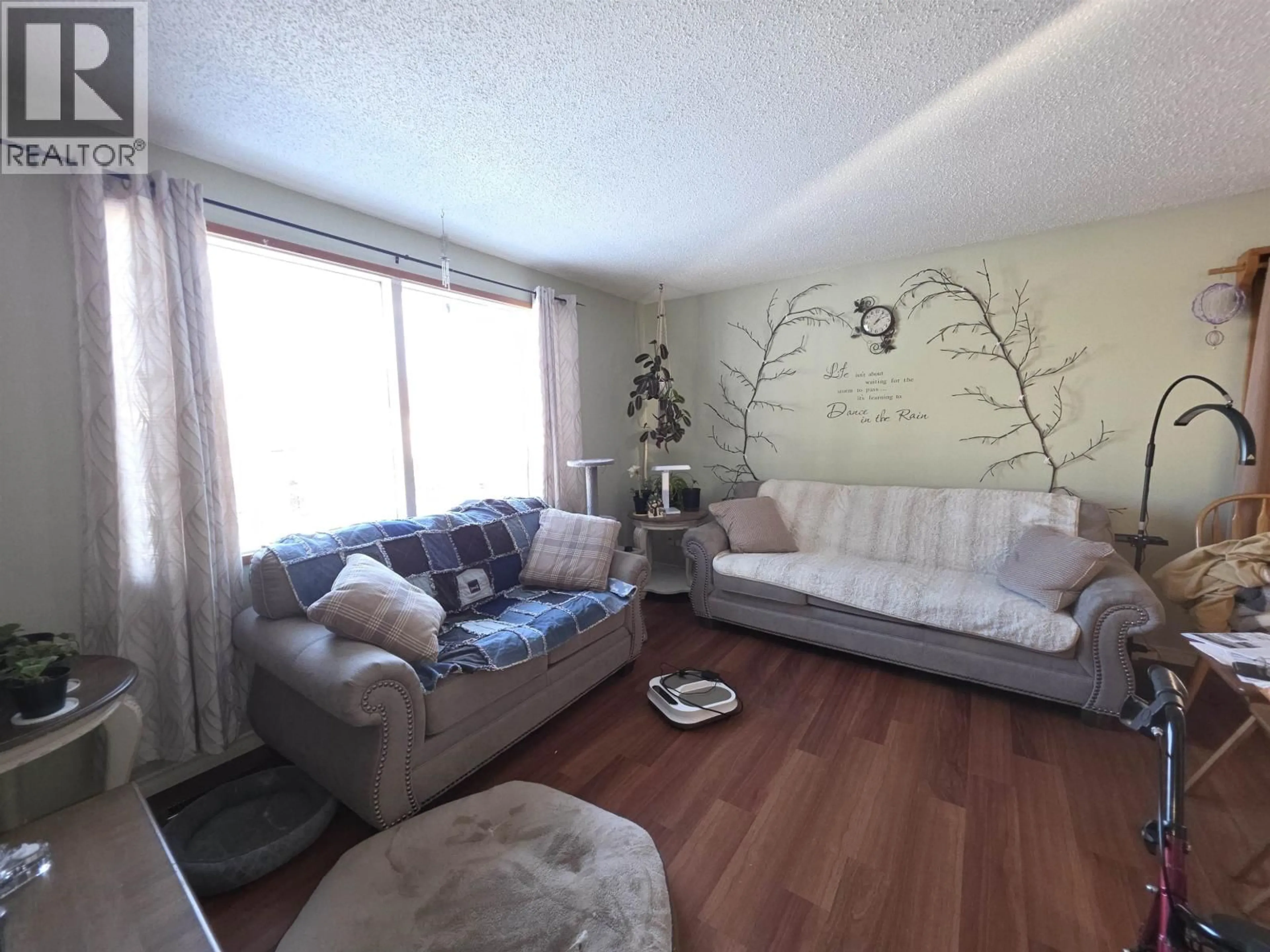 Living room with furniture, wood/laminate floor for 430 CHILAKO CRESCENT, Fraser Lake British Columbia V0J1S0