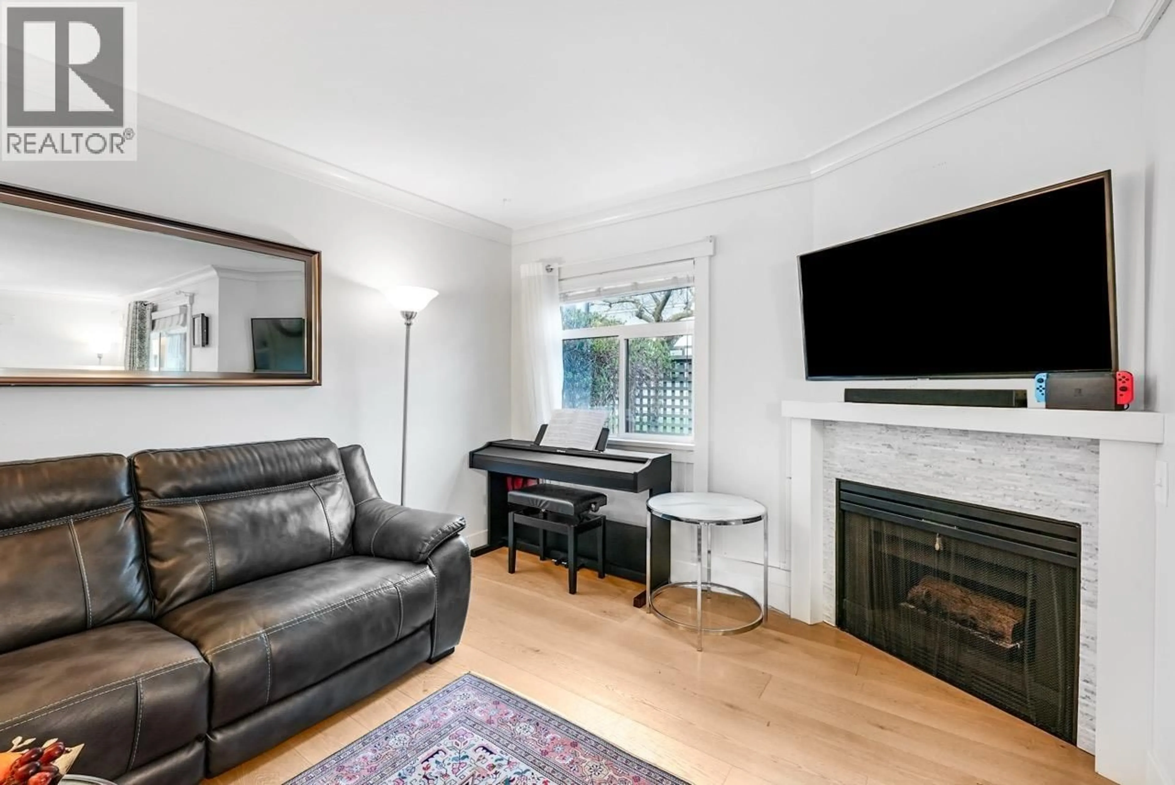 Living room with furniture, wood/laminate floor for 38 - 889 TOBRUCK AVENUE, North Vancouver British Columbia V7P1V9