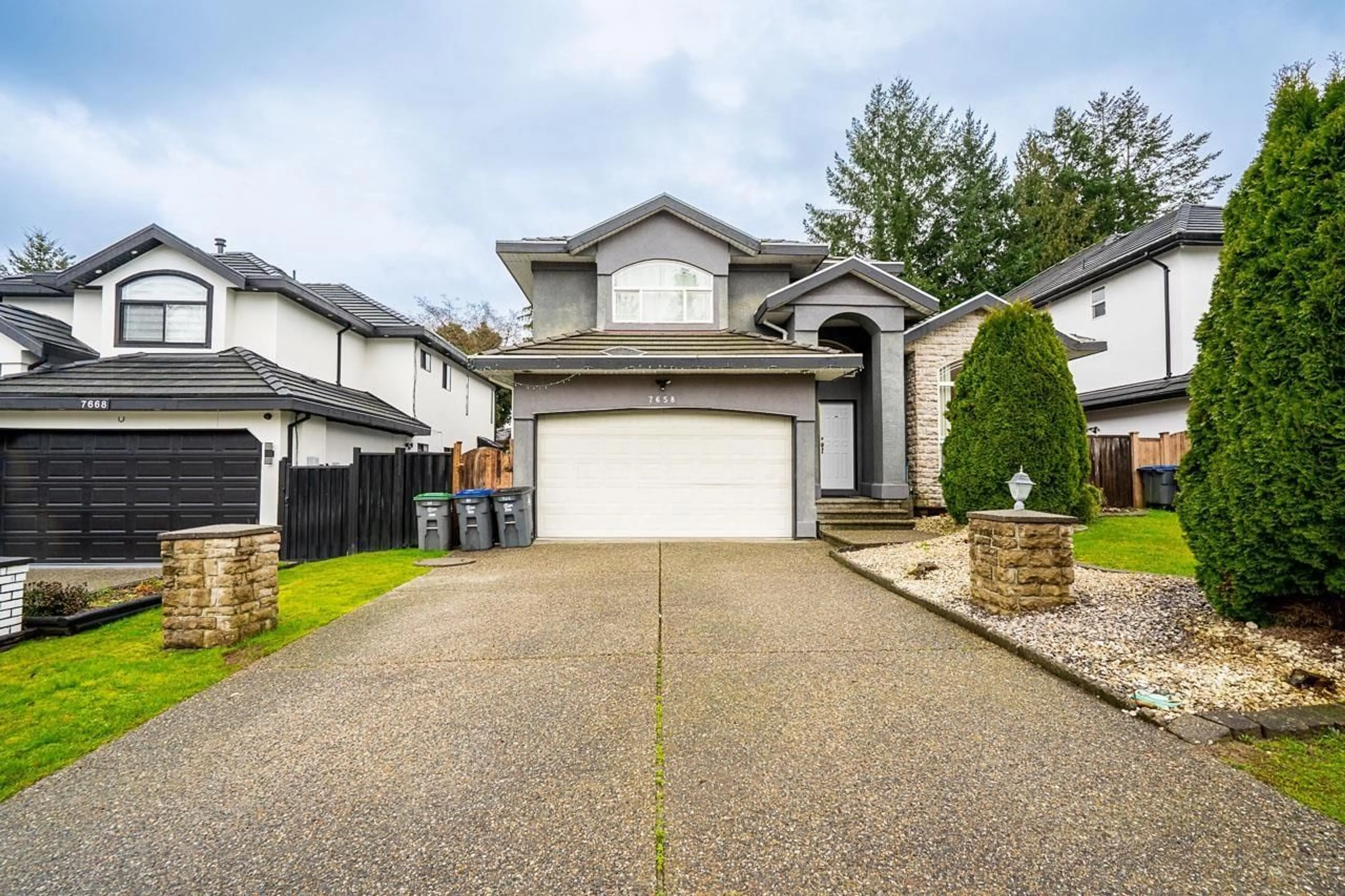 Home with vinyl exterior material, street for 7658 147A STREET, Surrey British Columbia V3S8Z3