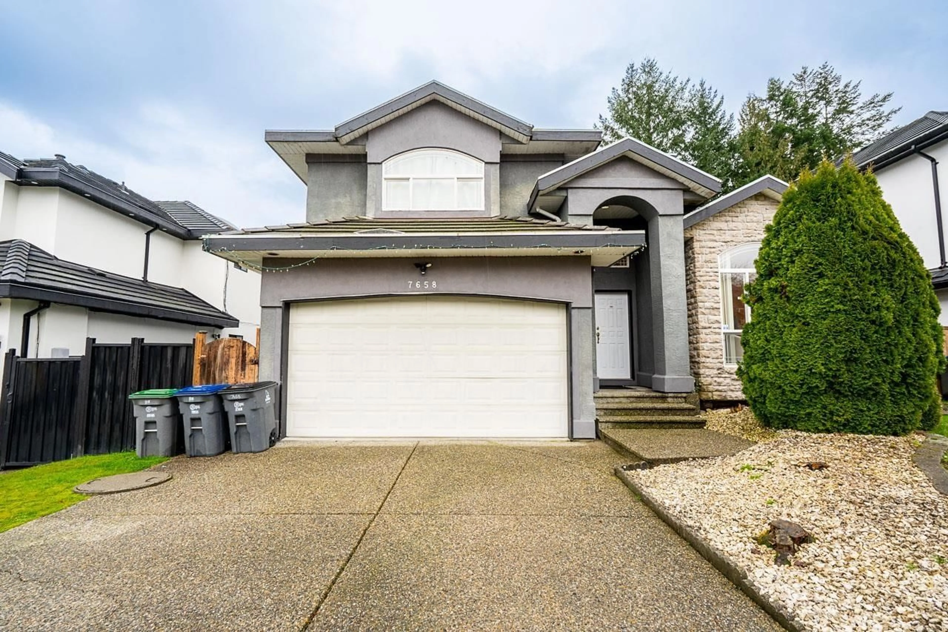 Home with vinyl exterior material, street for 7658 147A STREET, Surrey British Columbia V3S8Z3