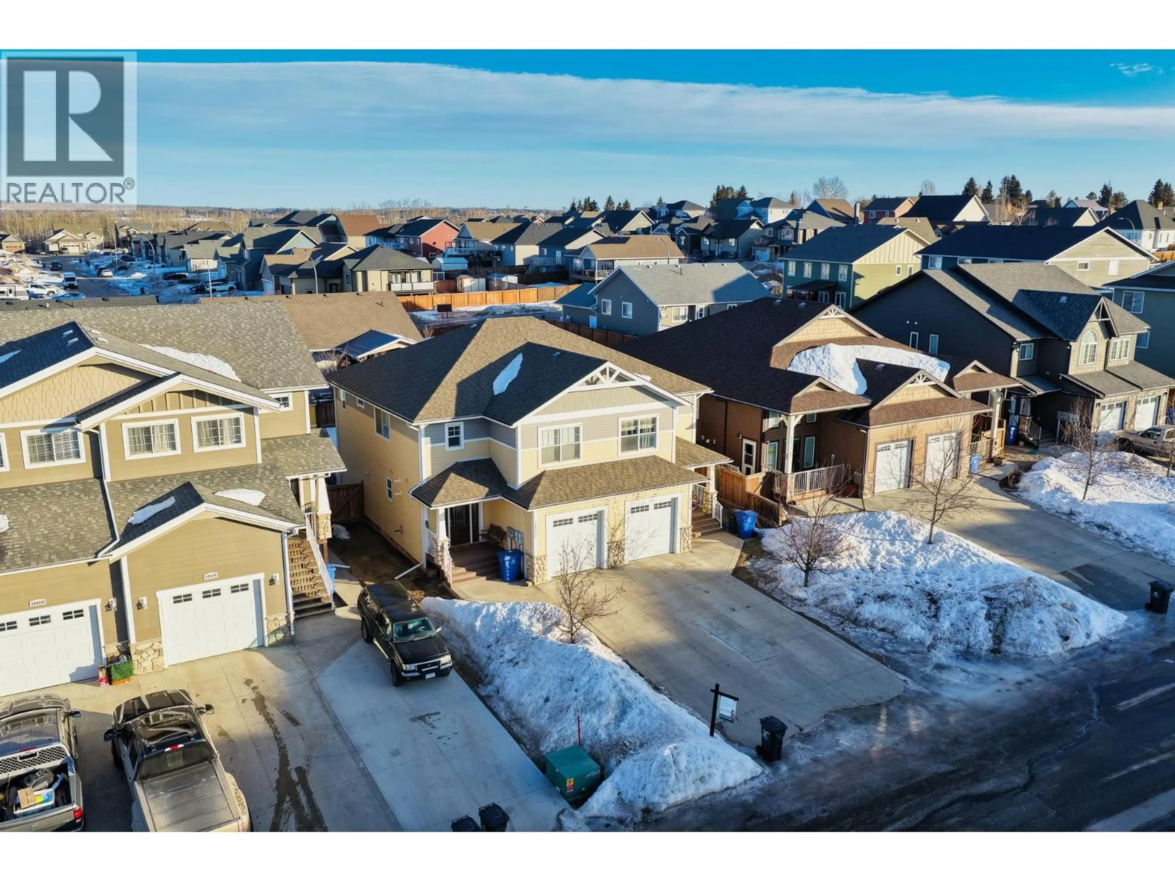 A pic from outside/outdoor area/front of a property/back of a property/a pic from drone, street for 10922 104A AVENUE, Fort St. John British Columbia V1J0J3